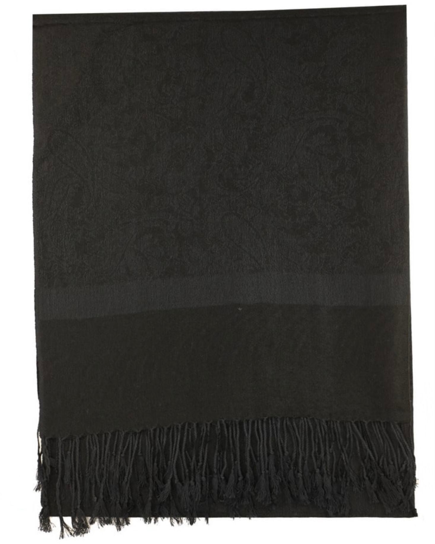 A black pashmina with paisley pattern and fringes spread out on a plain surface.