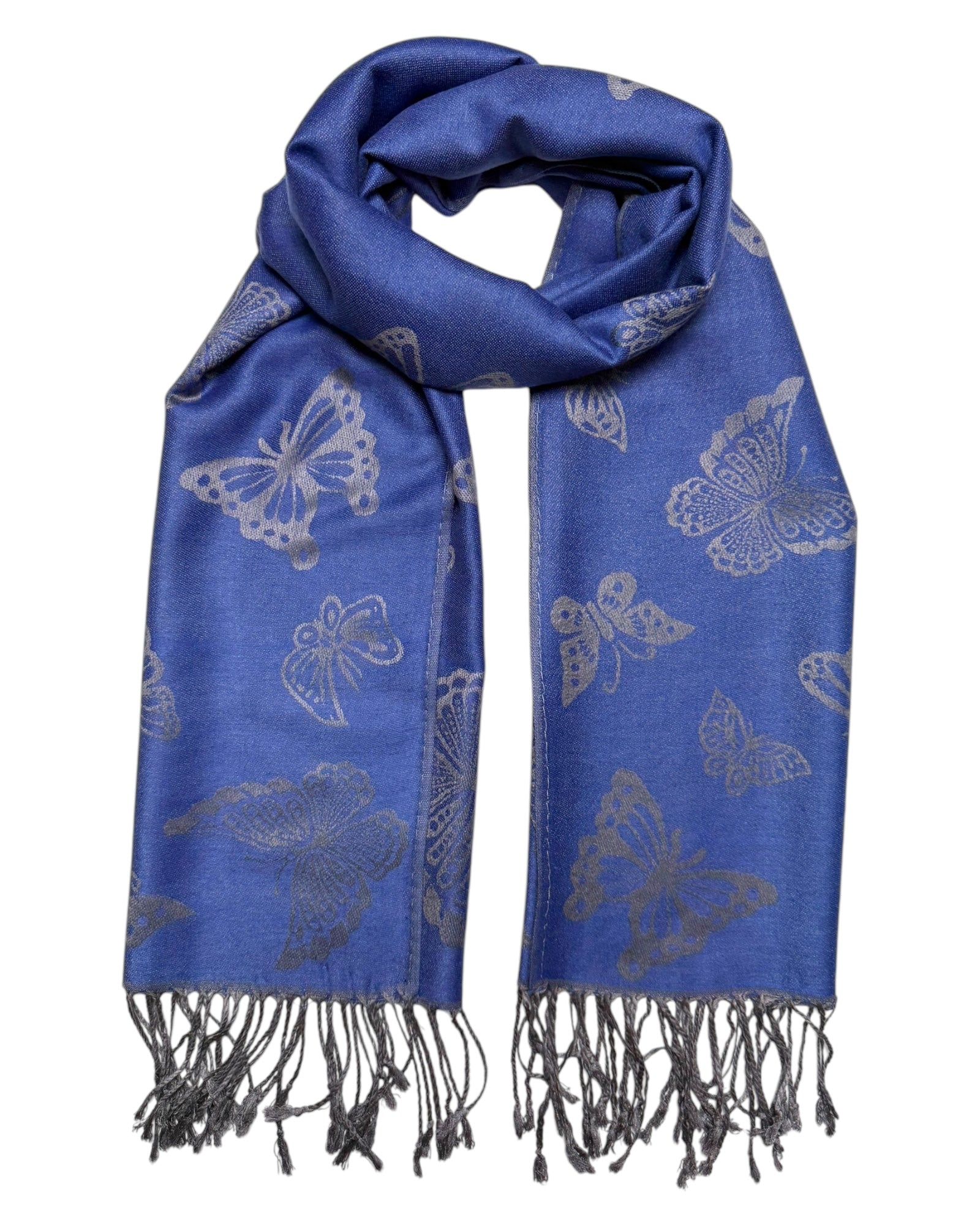 A blue pashmina scarf with a butterfly design, fringed ends, and a reversible pattern.