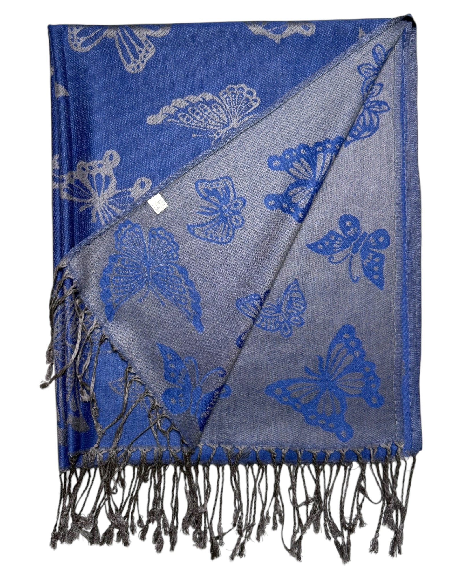 A blue and silver pashmina scarf with a butterfly design, fringed ends, and a reversible pattern.