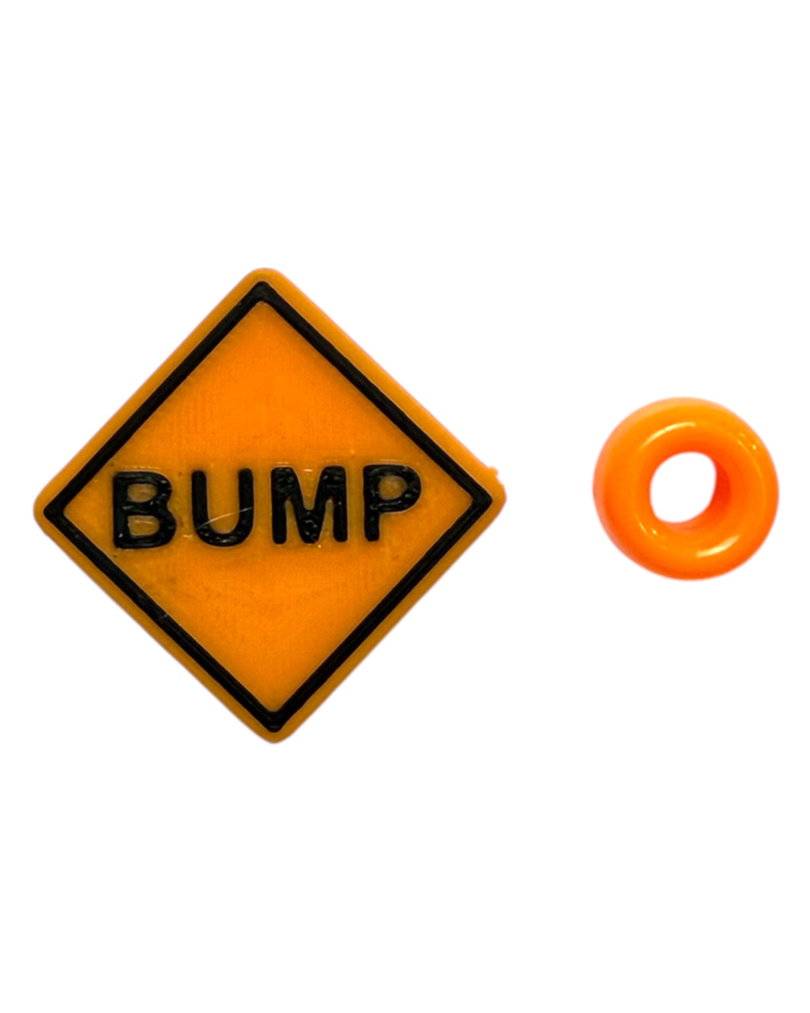 Orange 'BUMP' sign kandi bead with a small orange pony bead on a white background