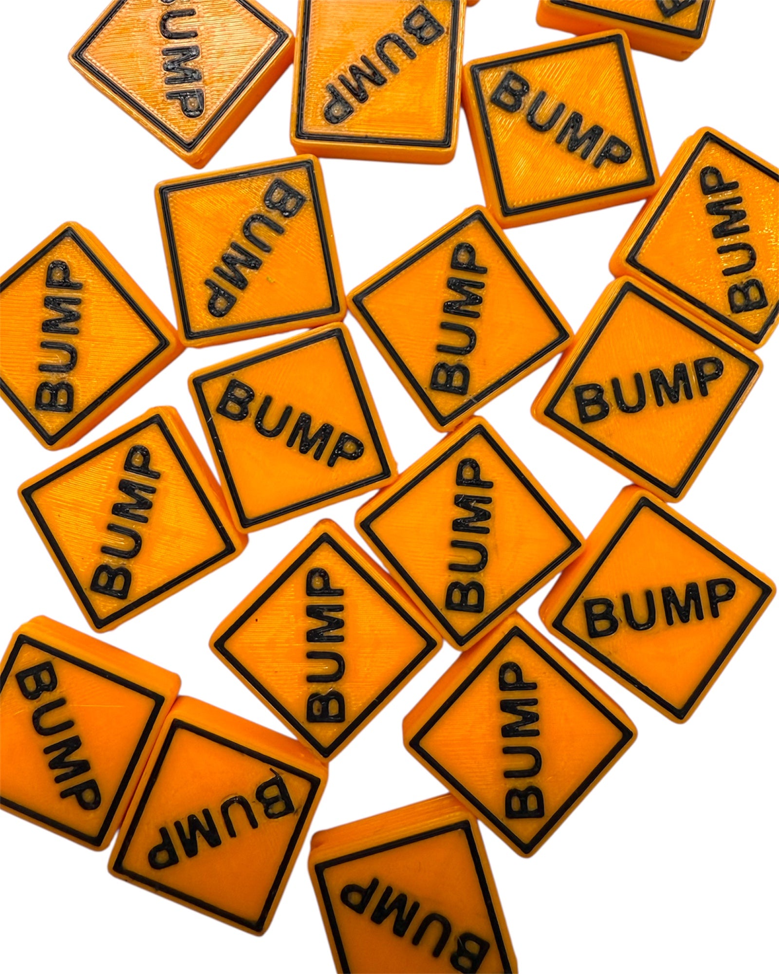 Orange square sign kandi beads with 'BUMP' text on a white background