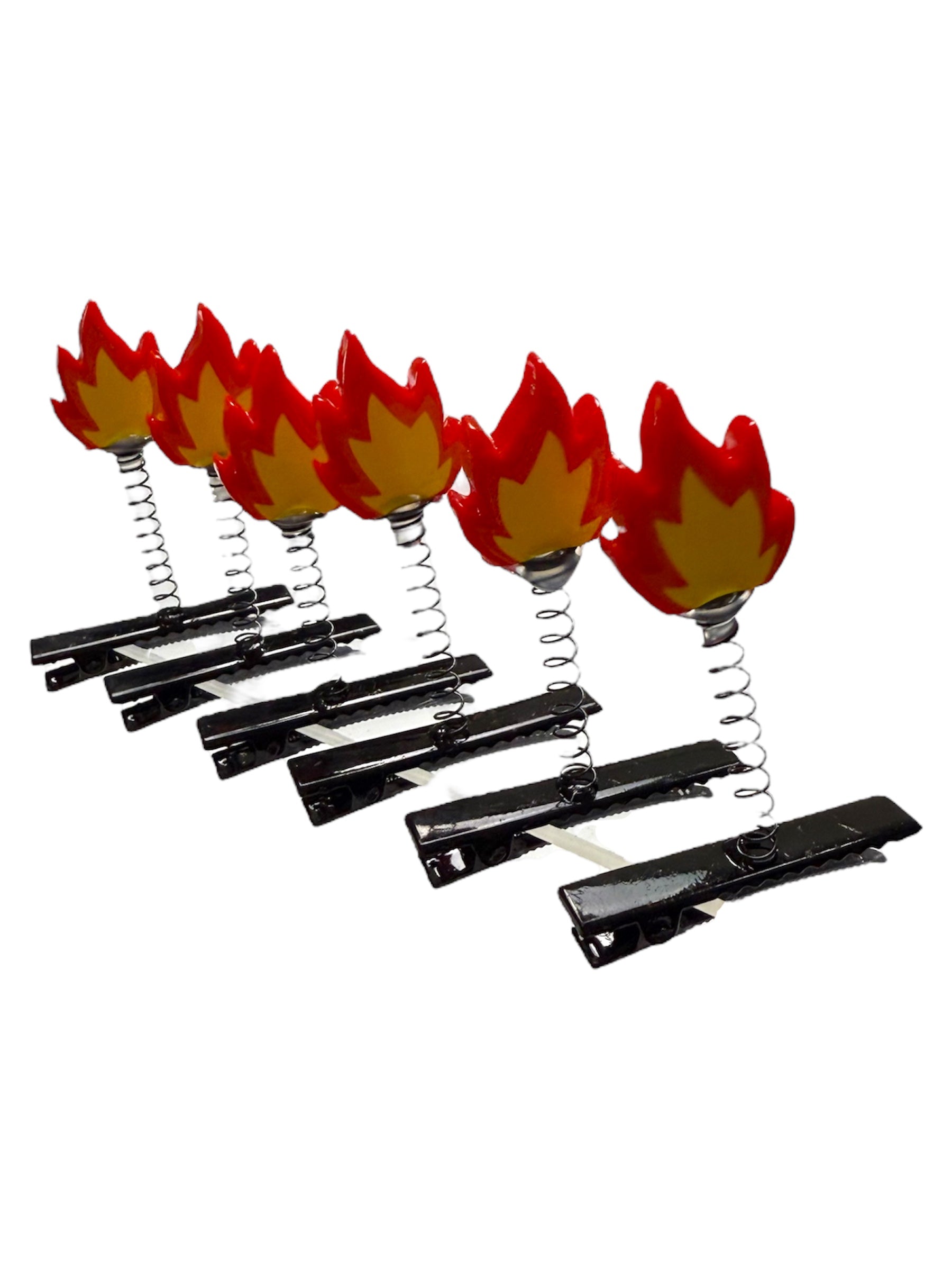 Set of hair clips with flame design on a white background