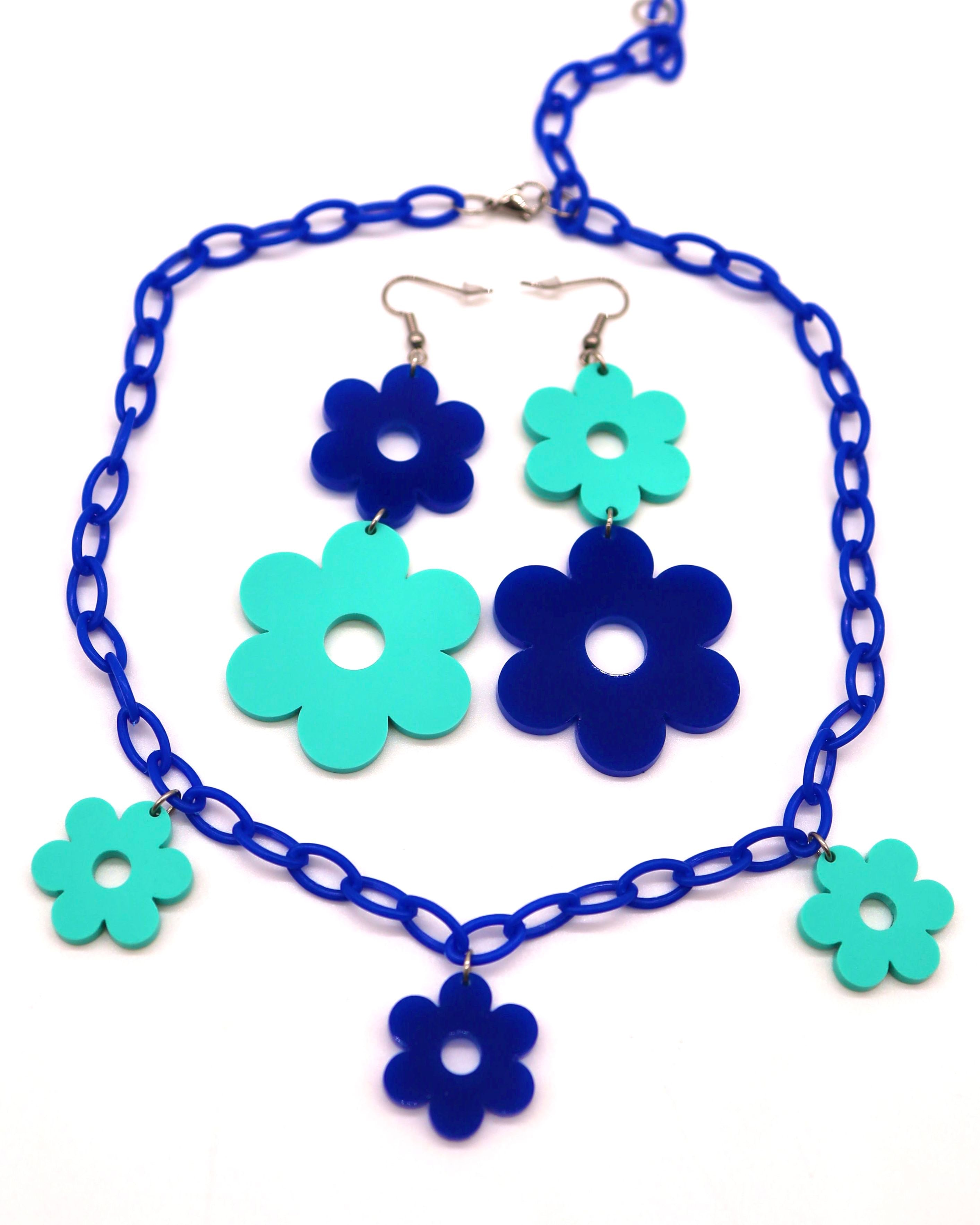 A pair of Flower Power Blue Earrings with the matching Flower Power Blue Necklace.