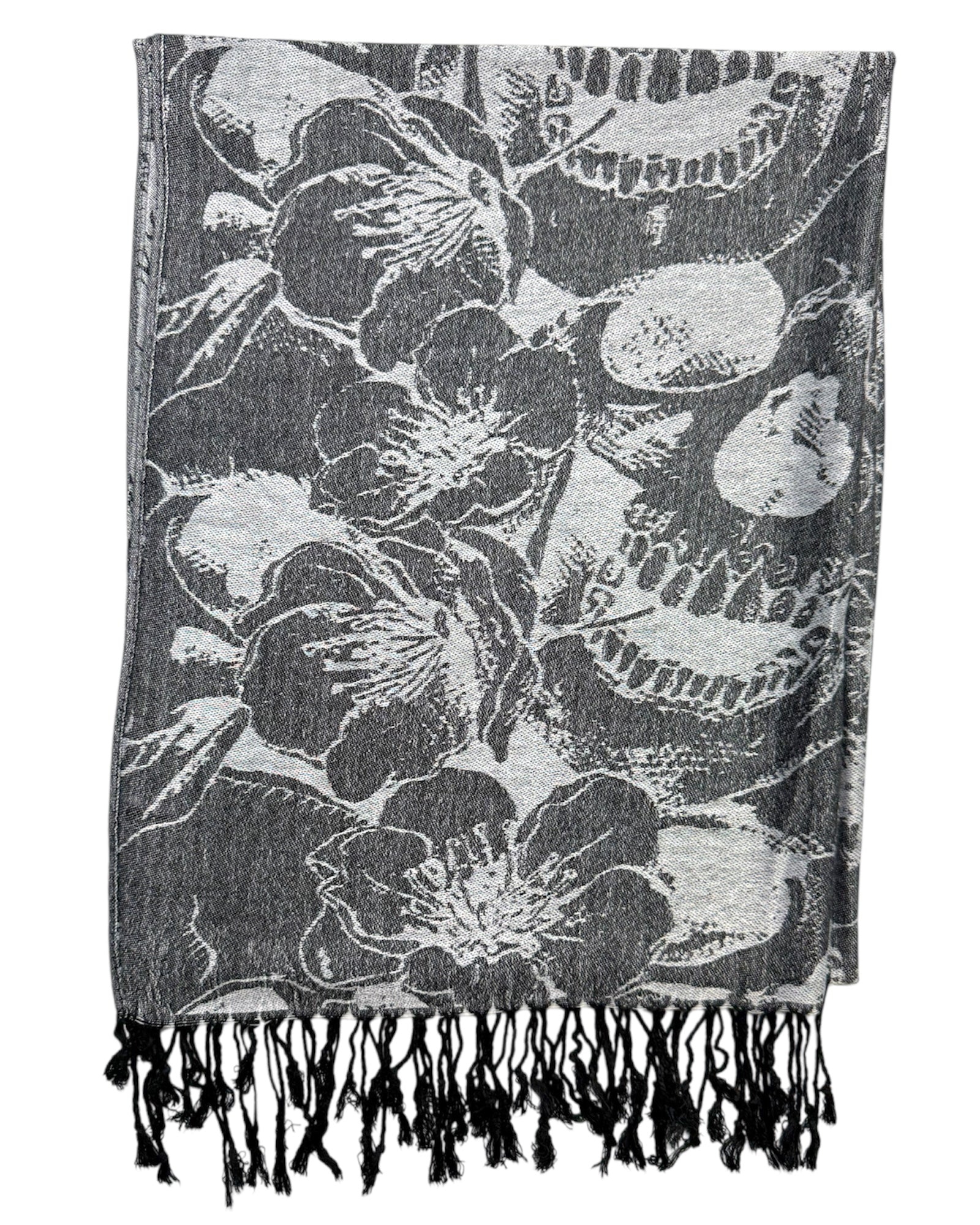skull patterned scarf with black and white design on a dark background
