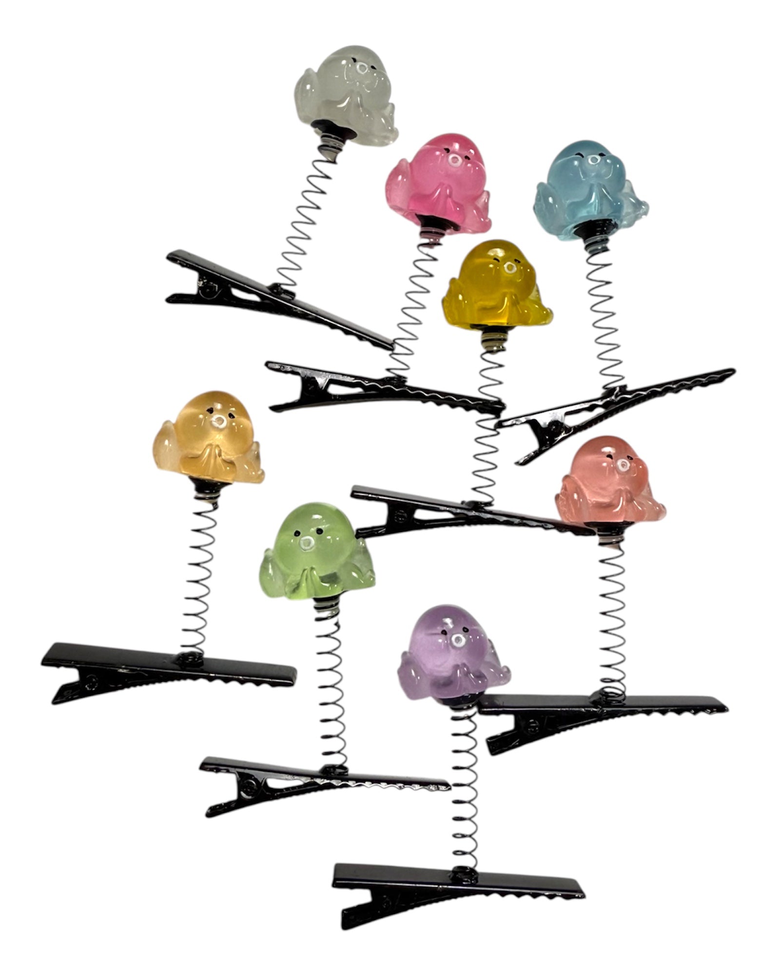 Colorful octopus-shaped hair clips on a white background