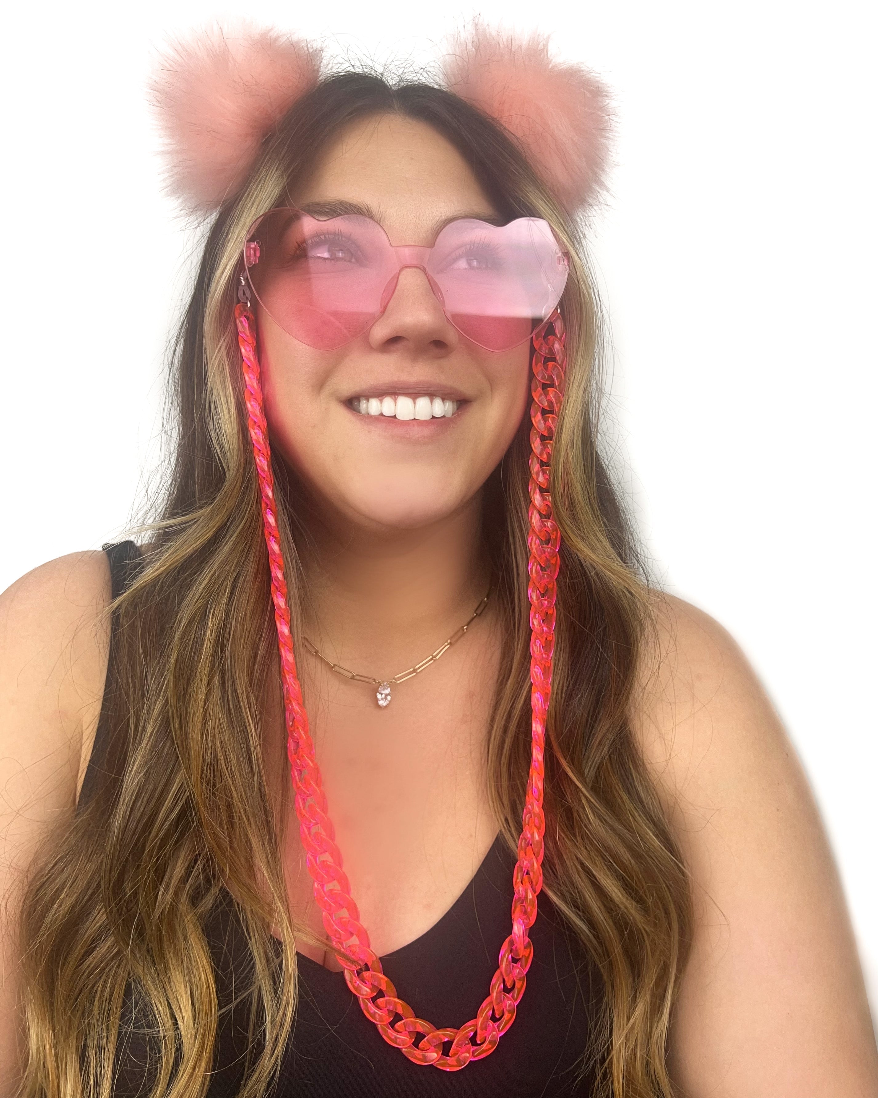 Pink heart sunglasses worn lifestyle shot