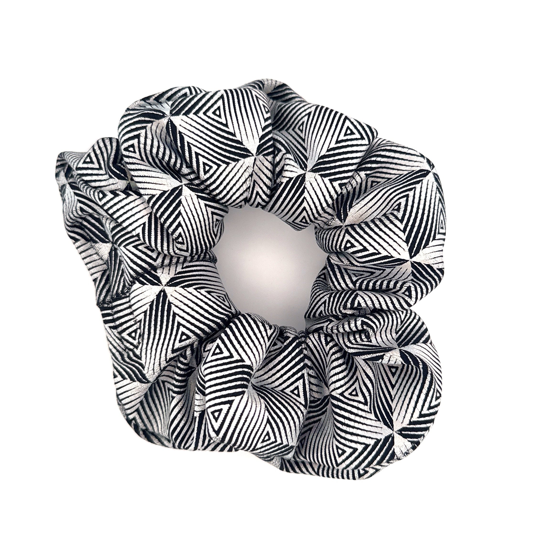 Black and white patterned scrunchie on a white background