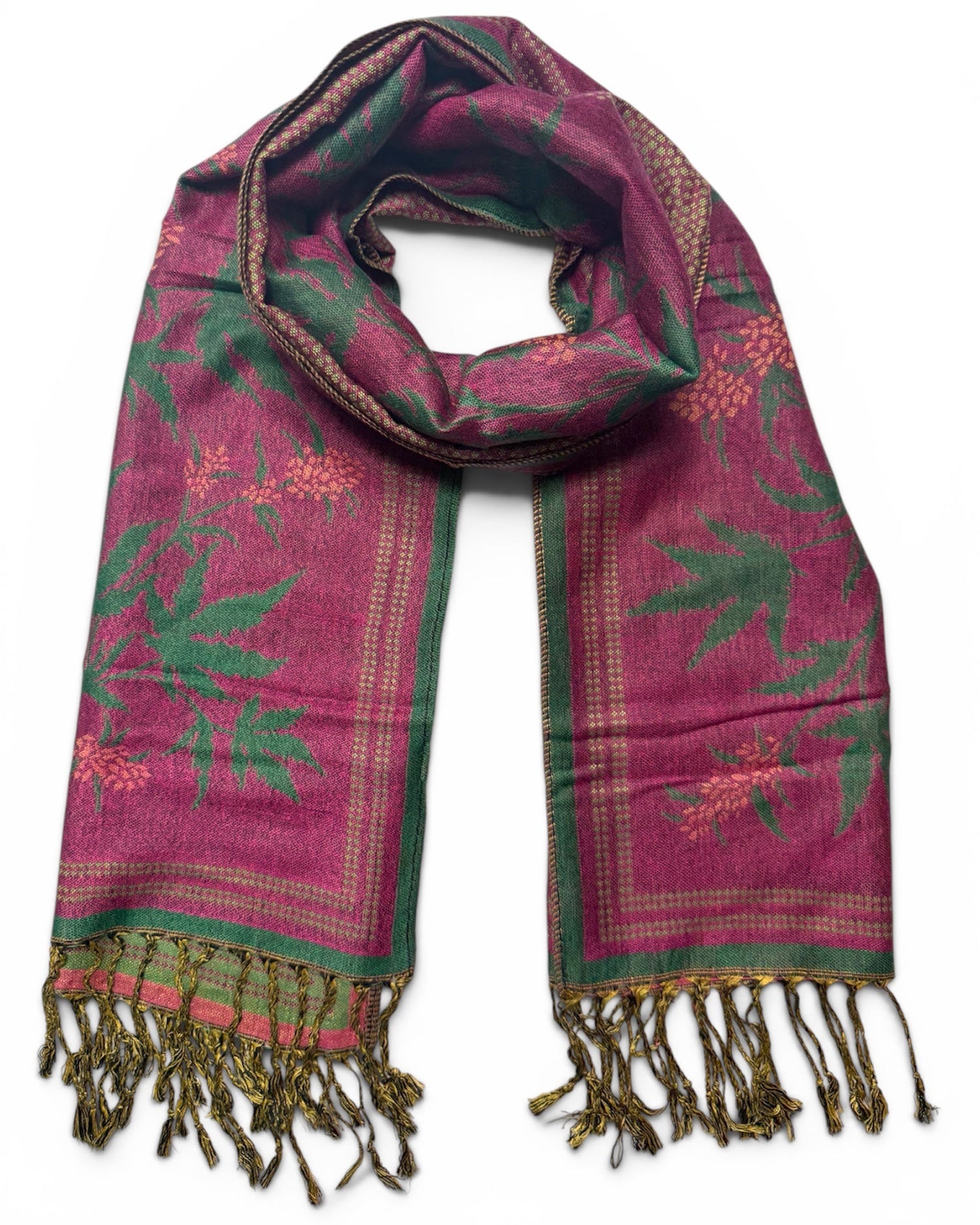 Pink and green patterned scarf with fringes on a white background