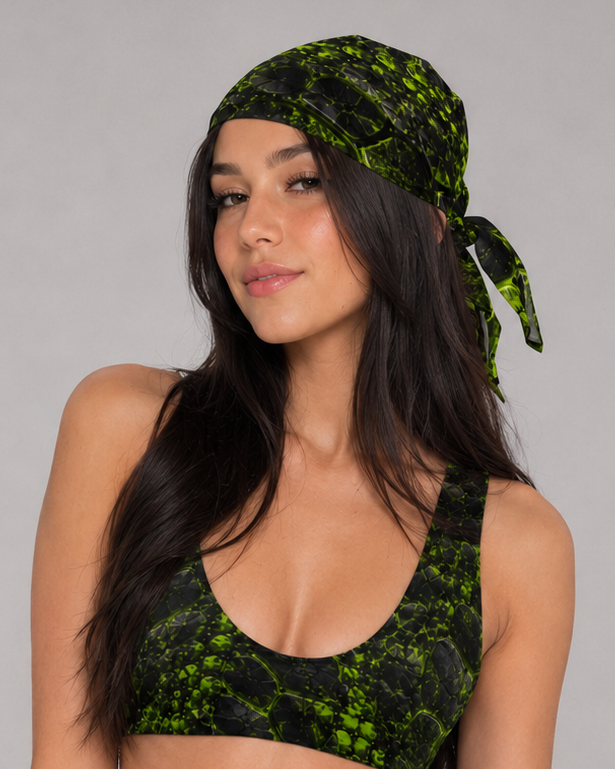 Woman wearing a black and neon green cracked-texture Ravage bandana tied at the back, with a matching bikini top.
