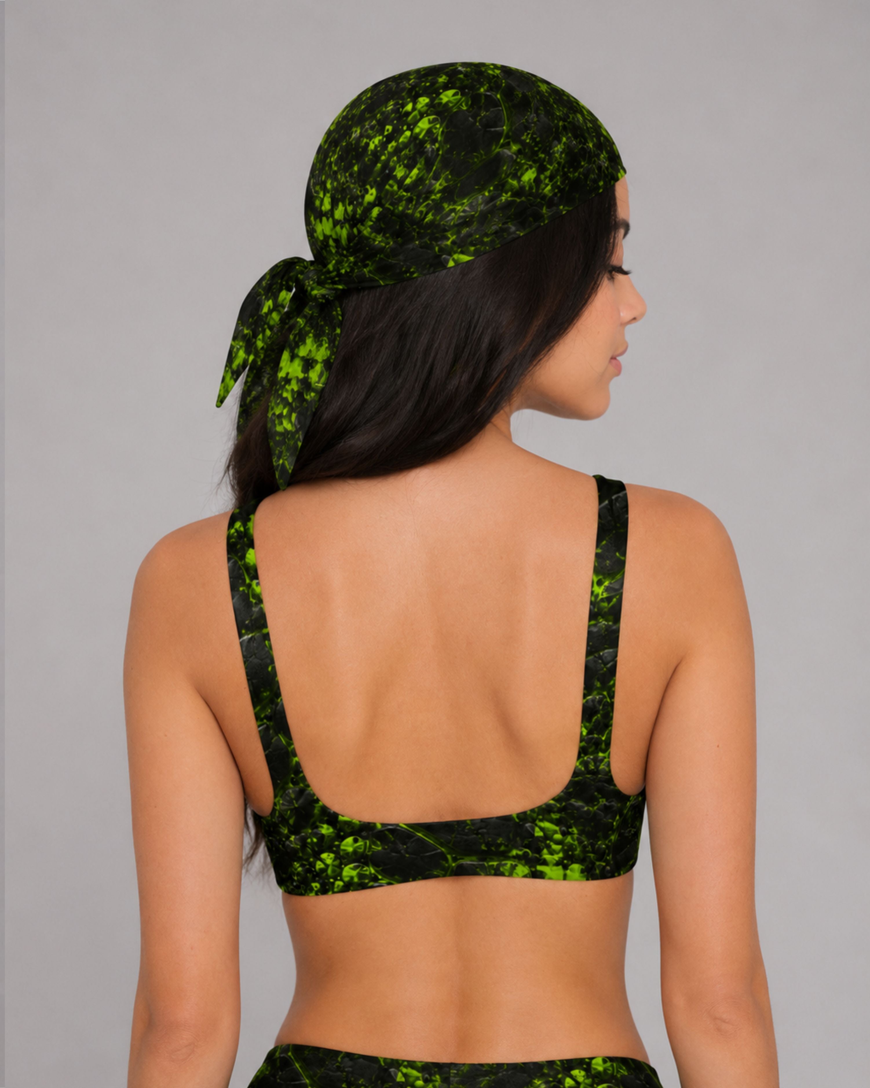 Back view of a green and black cracked-texture bikini top with matching bandana tied at the back of the head.