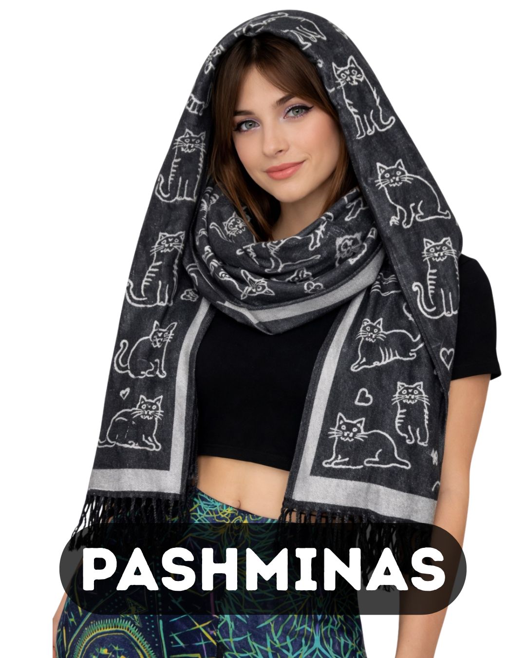 Woman wearing a black rave pashmina with cat patterns on a white background