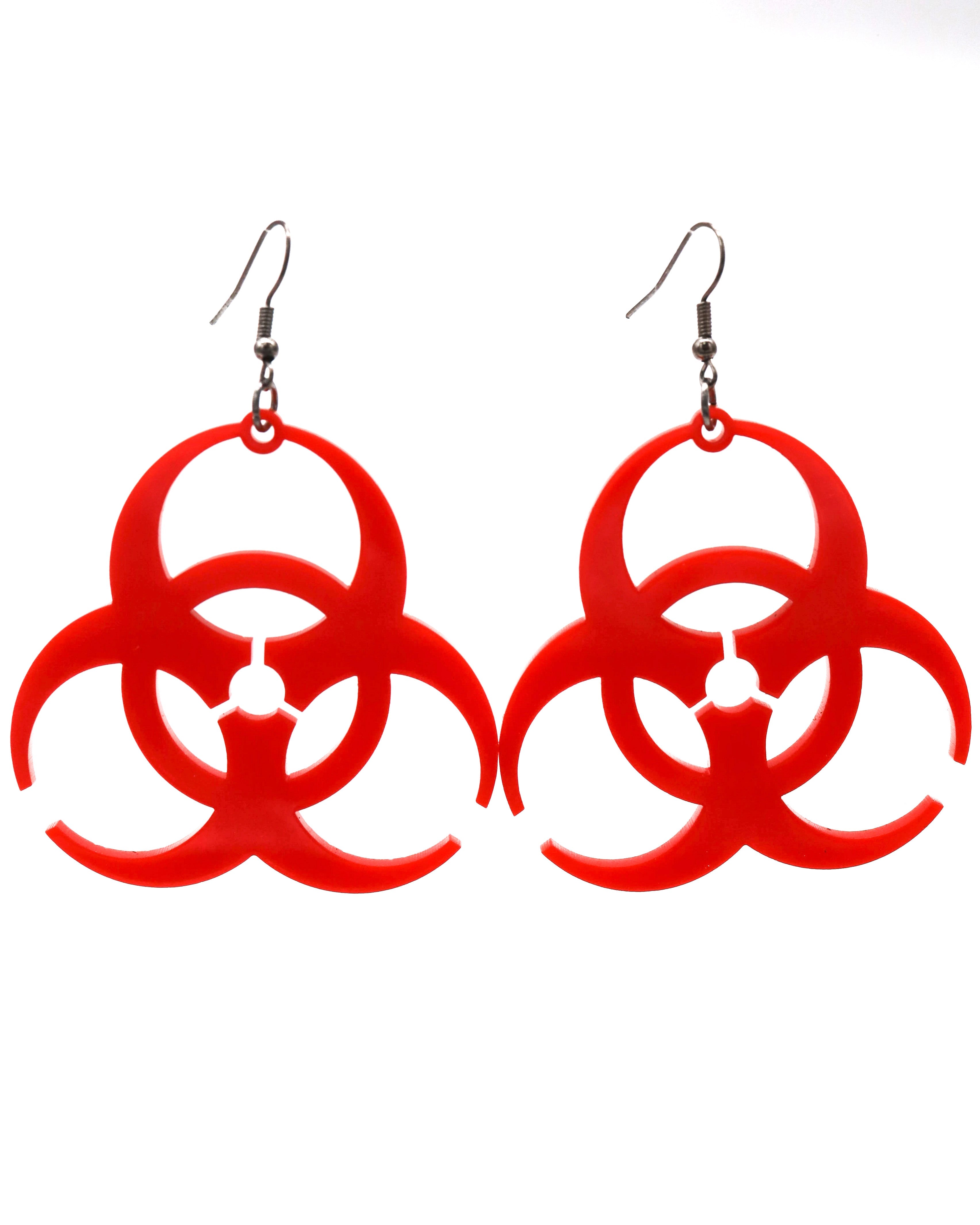 Red biohazard symbol earrings on a white background