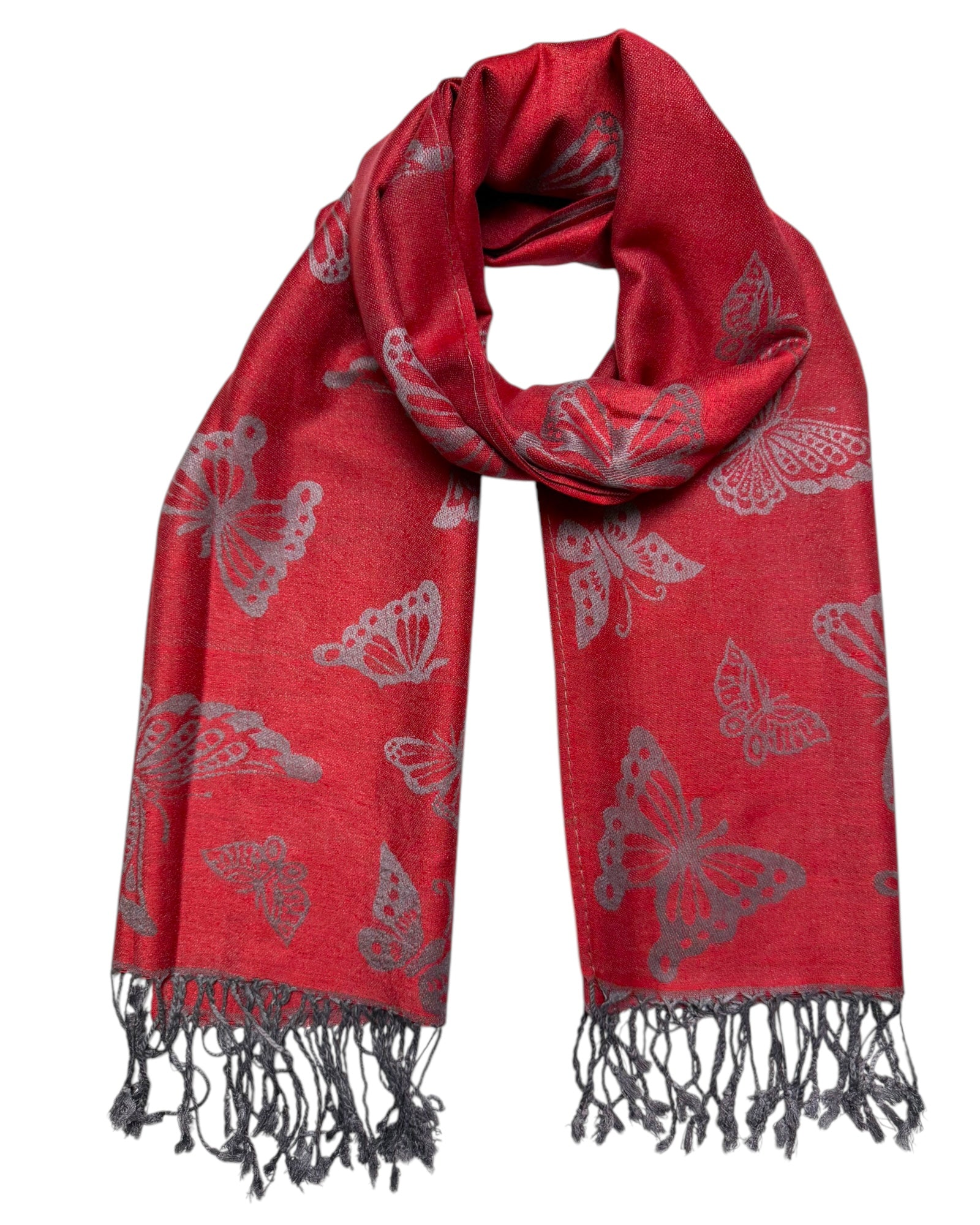 A red pashmina scarf with a butterfly pattern, fringed ends, and a reversible design.