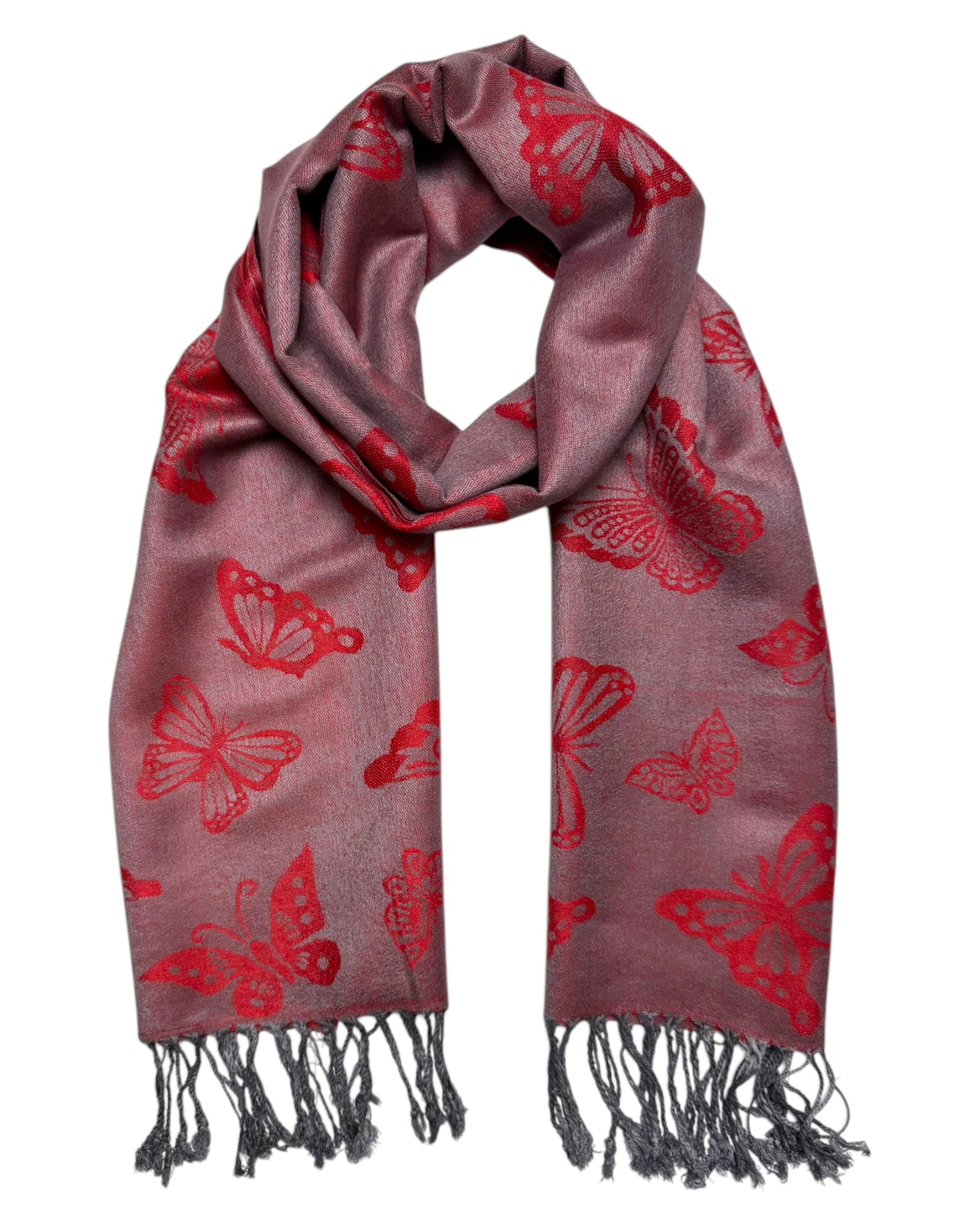 A red pashmina scarf with a butterfly pattern, fringed ends, and a reversible design.