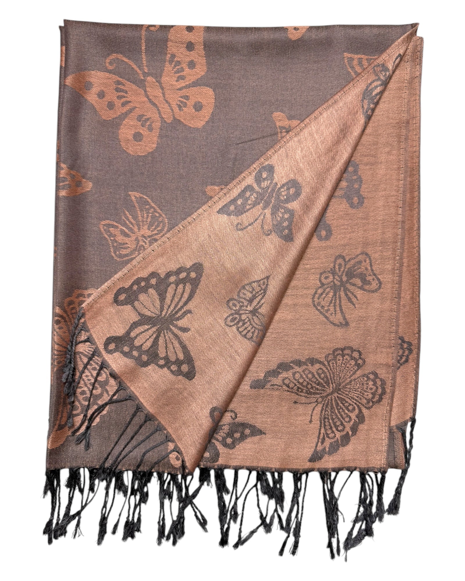A scarf with a reversible design featuring butterfly patterns on a rose gold and grey background with fringe trim.
