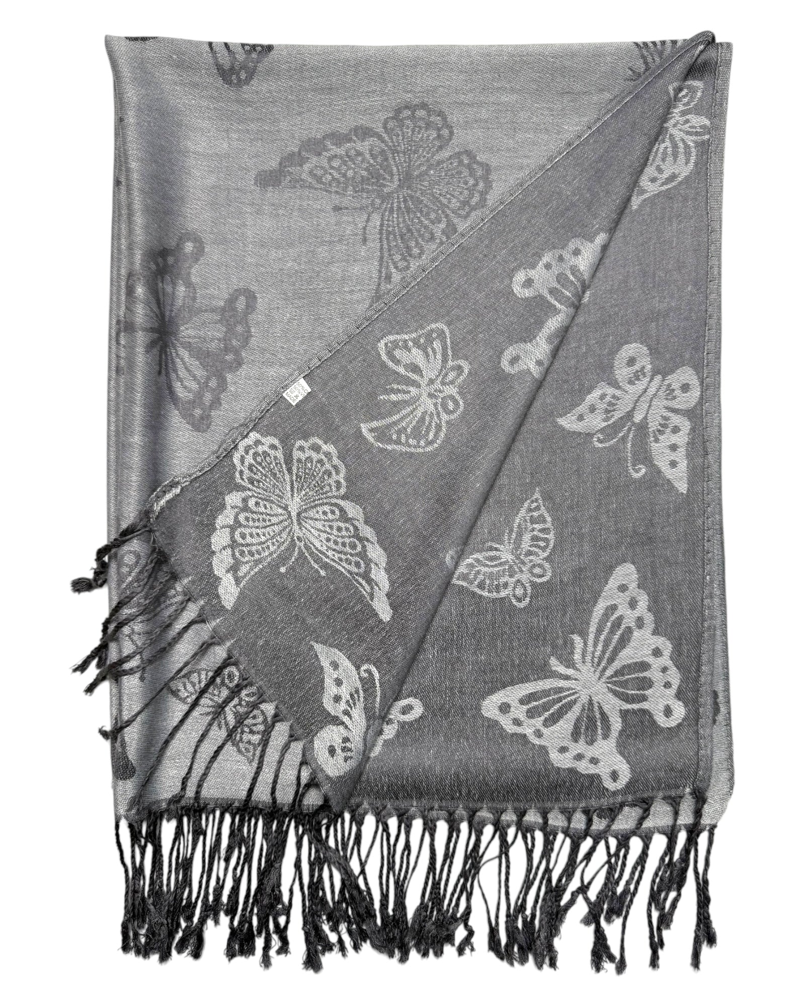 A silver and grey reversible pashmina scarf with a butterfly motif, fringed edges, and a shimmering texture, displayed against a white background.