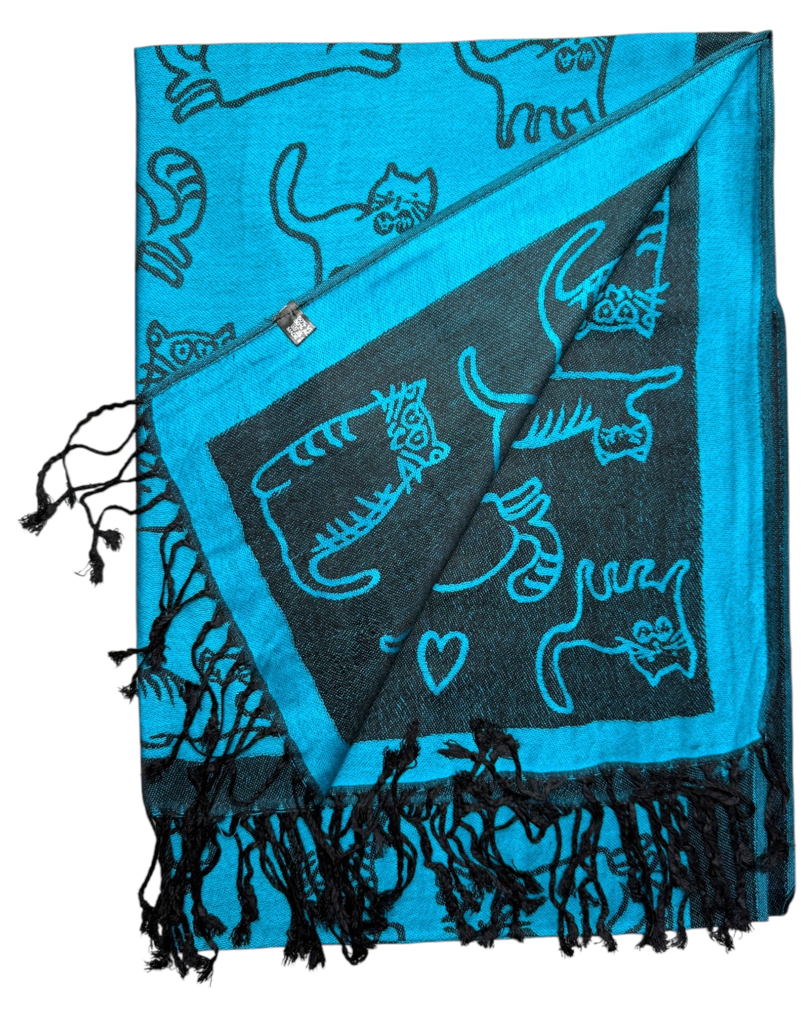 A turquoise blue pashmina scarf with black reversible side, adorned with playful cat designs, fringed ends, and a soft, draped texture.
