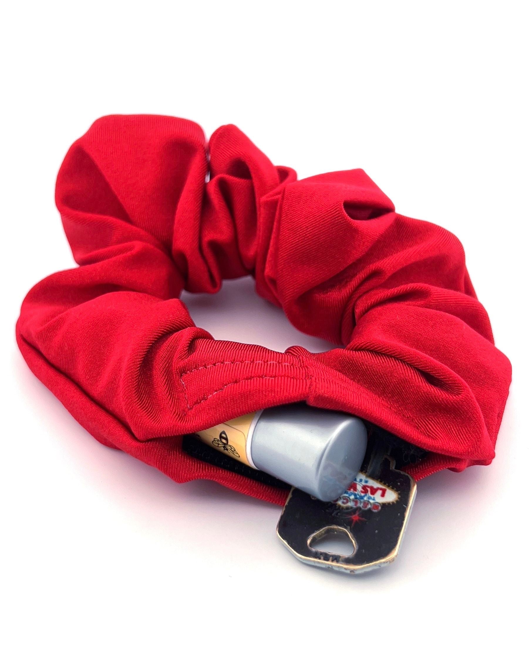 Red Stashie with Hidden Pocket – A striking red stash scrunchie with a secure Velcro® pocket, offering a bold color and functional hidden storage for keys, cash, or chapstick.