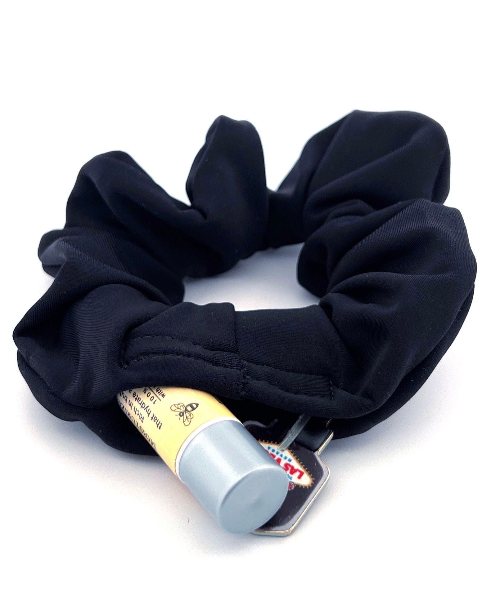 Black Stashie with Hidden Pocket – A sleek black stash scrunchie with a discreet 2-inch Velcro® pocket, perfect for storing small essentials like cash, keys, or lip balm.