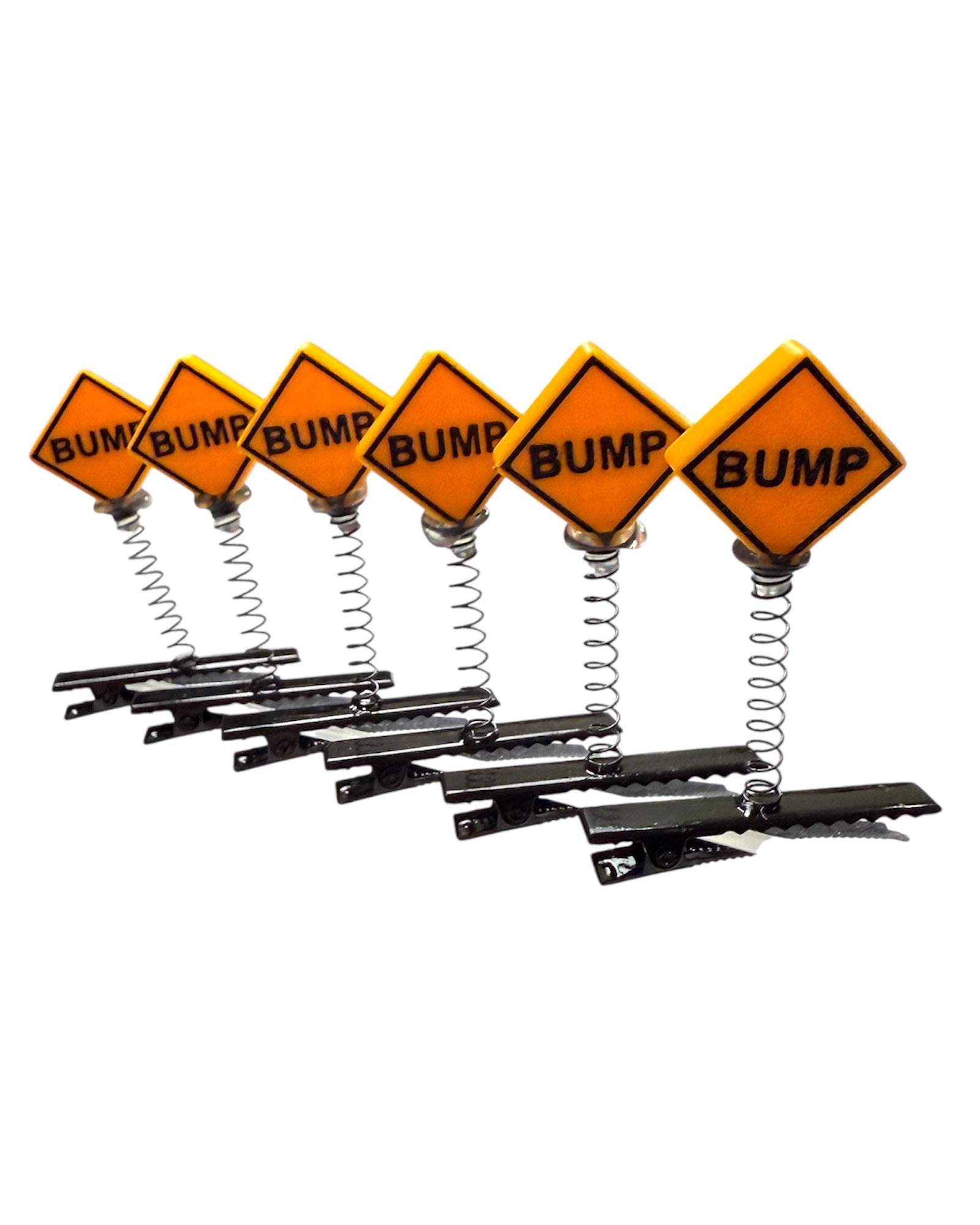 Set of six orange 'BUMP' signs with springs on a white background