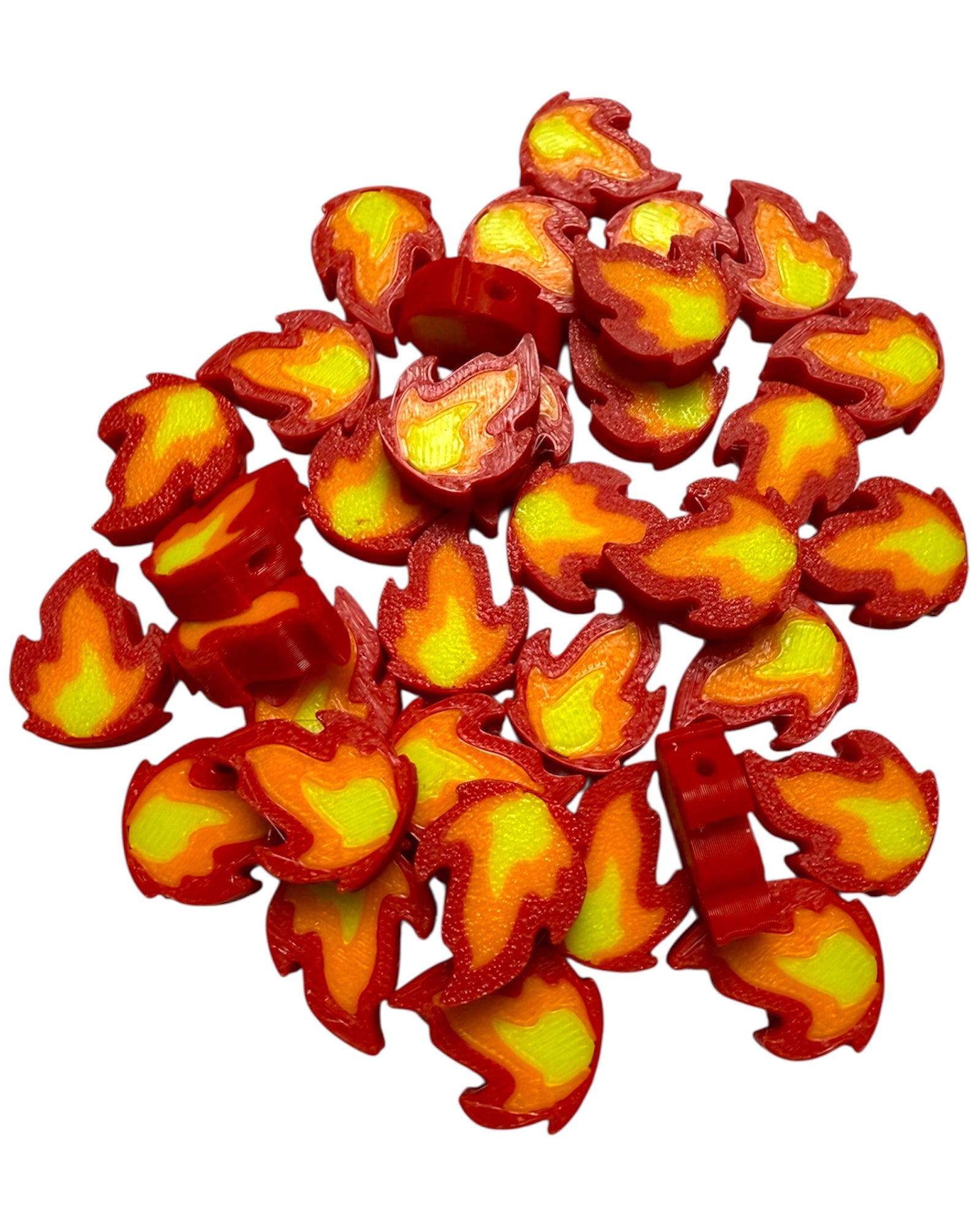Red and yellow fire-shaped beads on a white background