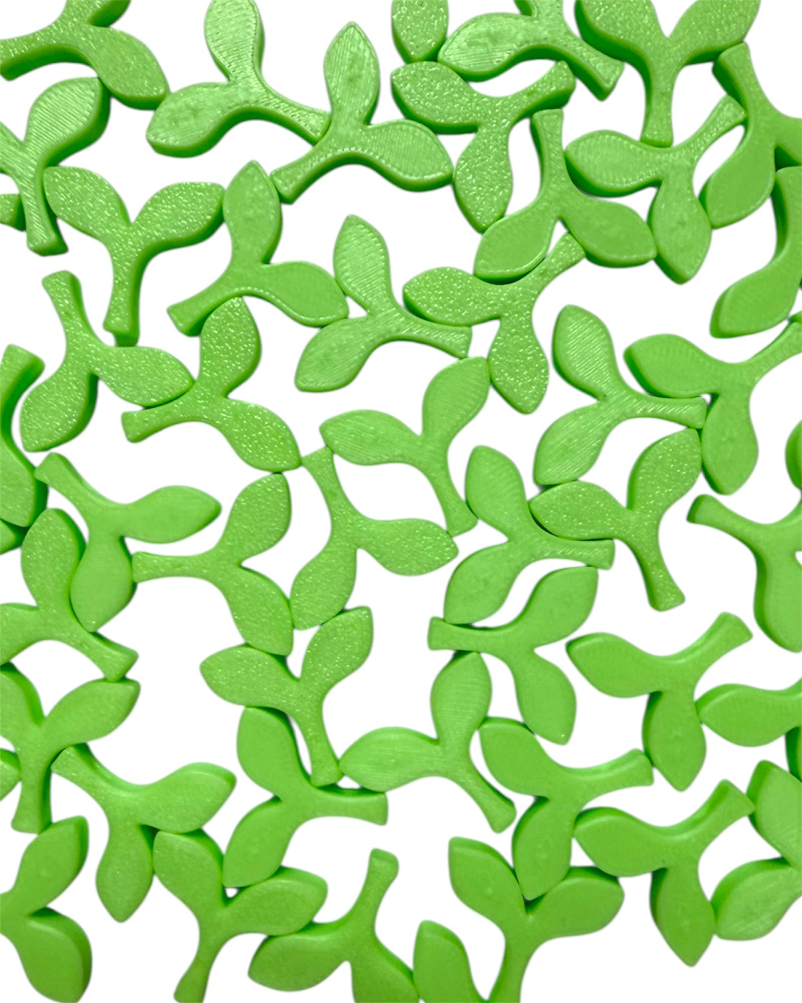 Pile of neon green glow-in-the-dark sprout kandi beads on a white background, perfect for rave bracelets and festival accessories.