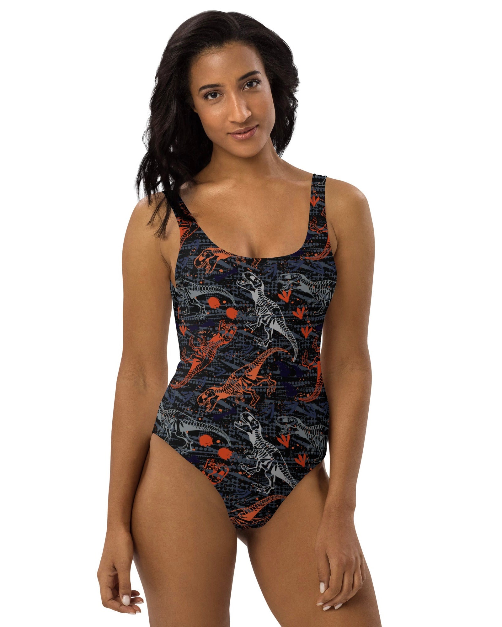 Front view of model rocking One Stop Rave's T-Wrecked Bodysuit with a dynamic dinosaur print.