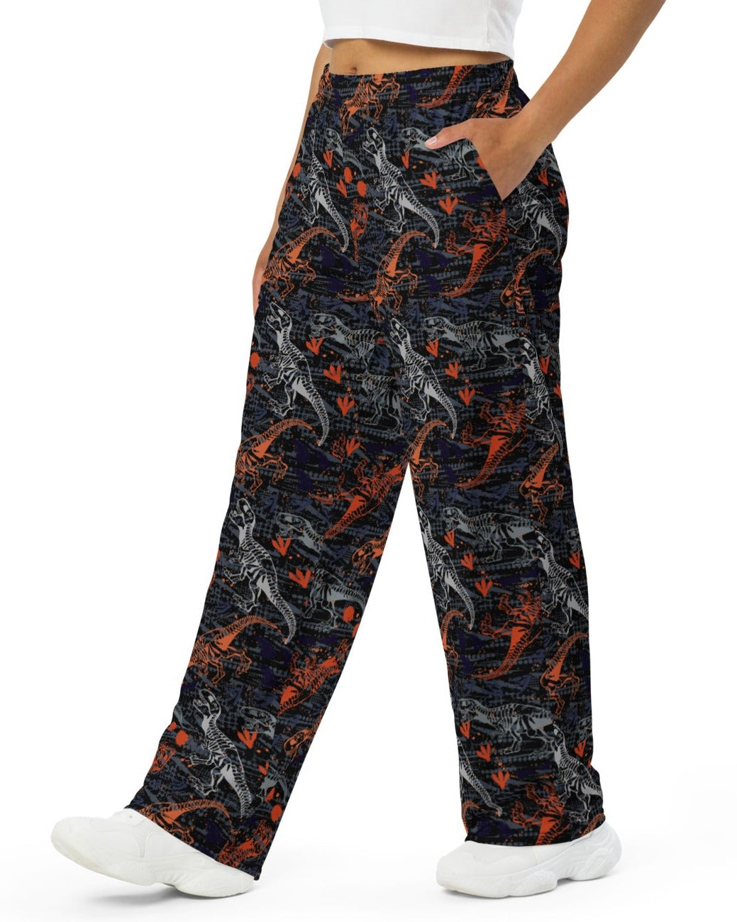 Side view of model rocking One Stop Rave's T-Wrecked Wide Leg Pants with a distinct dinosaur print.