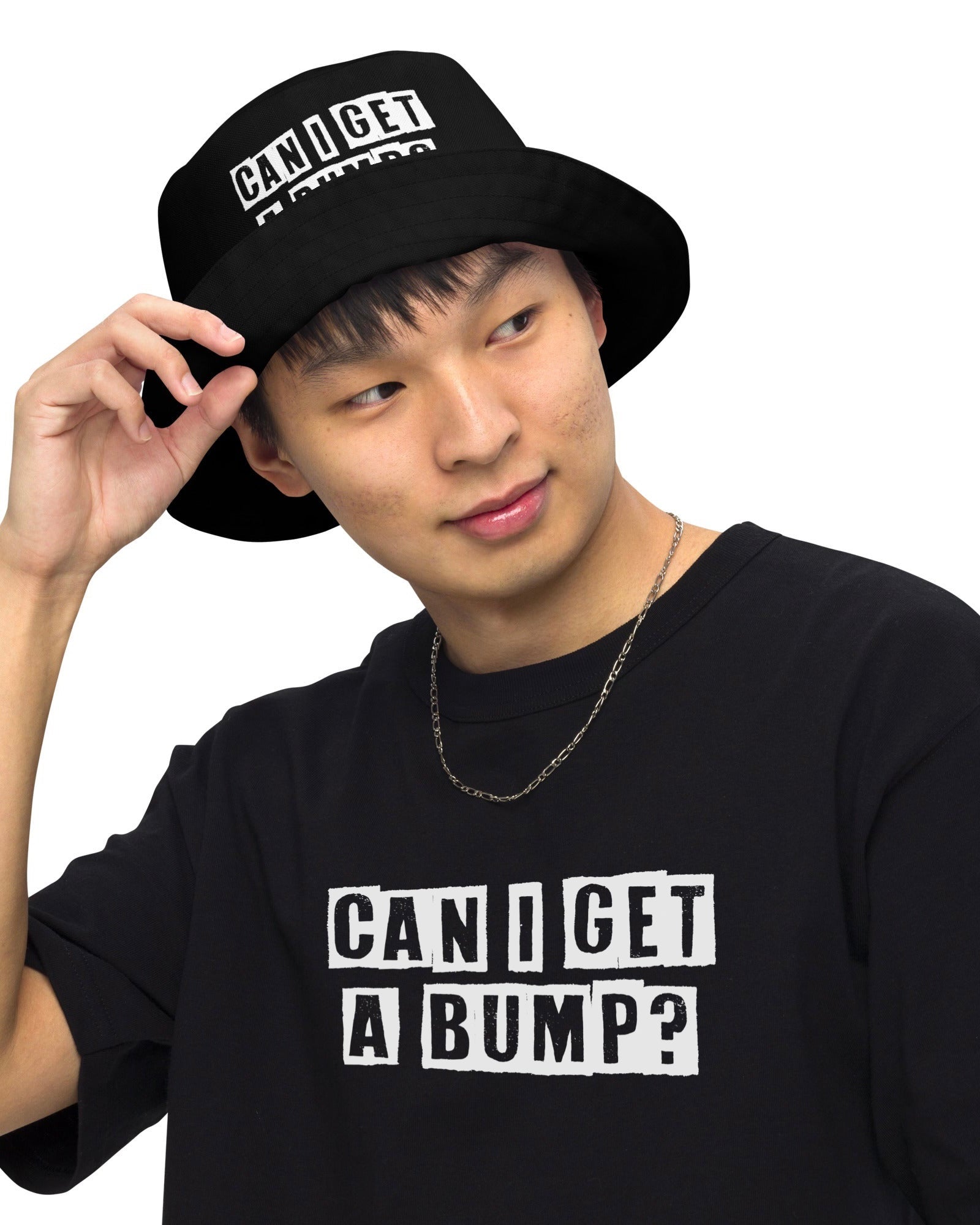 Model wearing a black bucket hat & t-shirt with the phrase "CAN I GET A BUMP?".