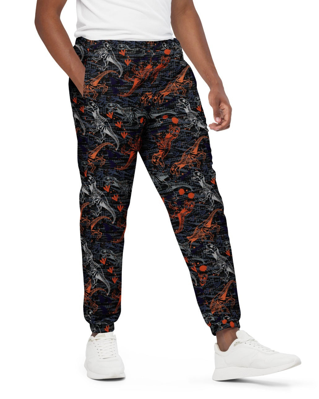 Side view of model wearing One Stop Rave's T-Wrecked Unisex Track Pants, showing off the dynamic dinosaur print.