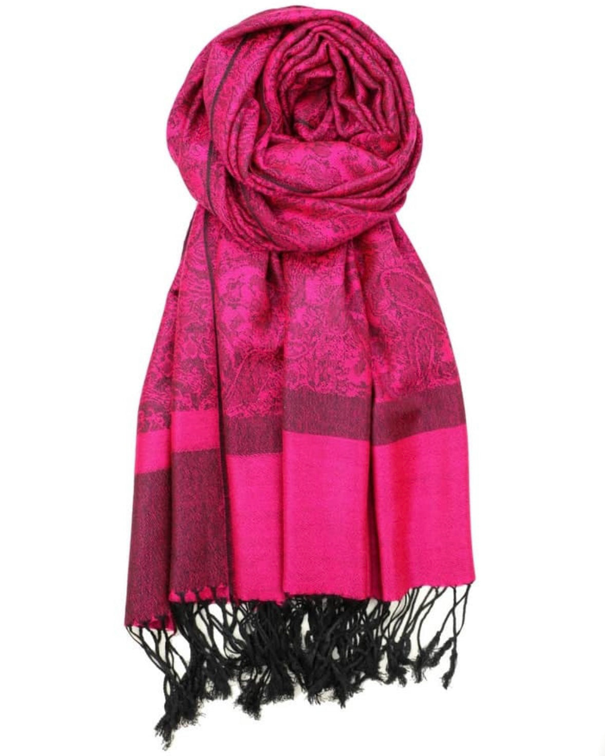 A magenta paisley rave pashmina with black fringes at the ends, draped elegantly around a model.