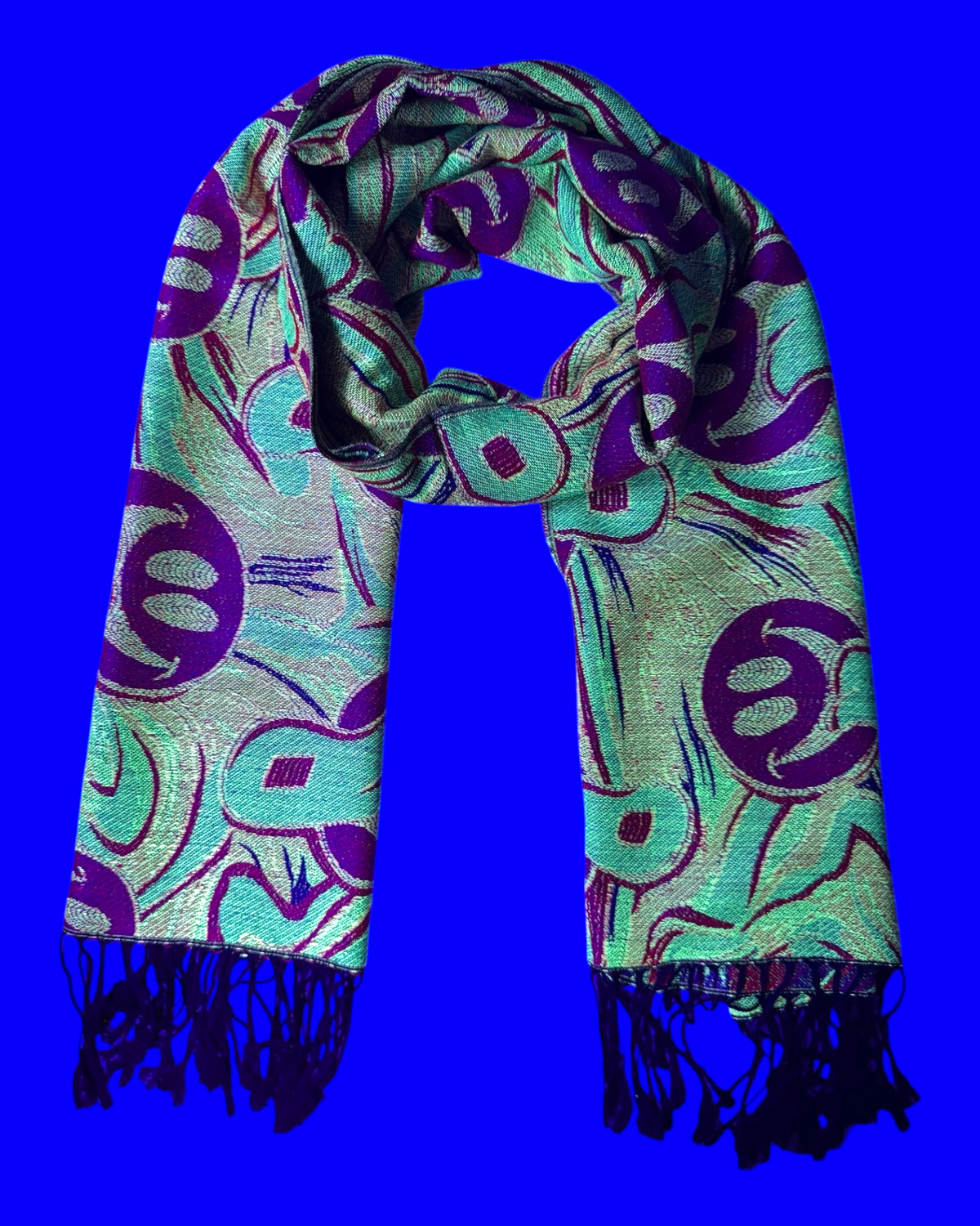 One Stop Rave reversible jacquard festival scarf with purple and yellow abstract smiley face pattern and black fringe