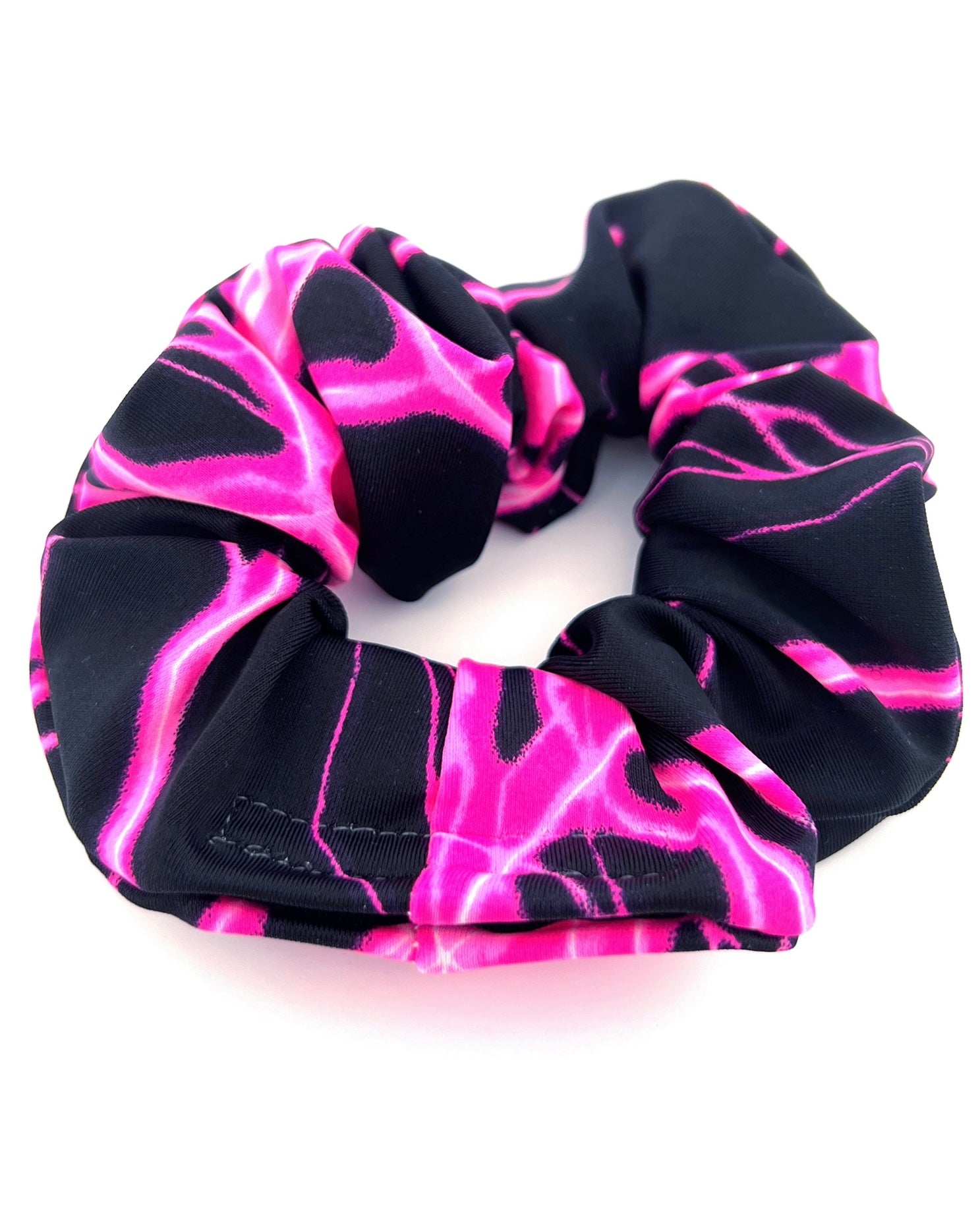Pink Surge Stashie scrunchie hair tie with hidden Velcro® pocket closed.