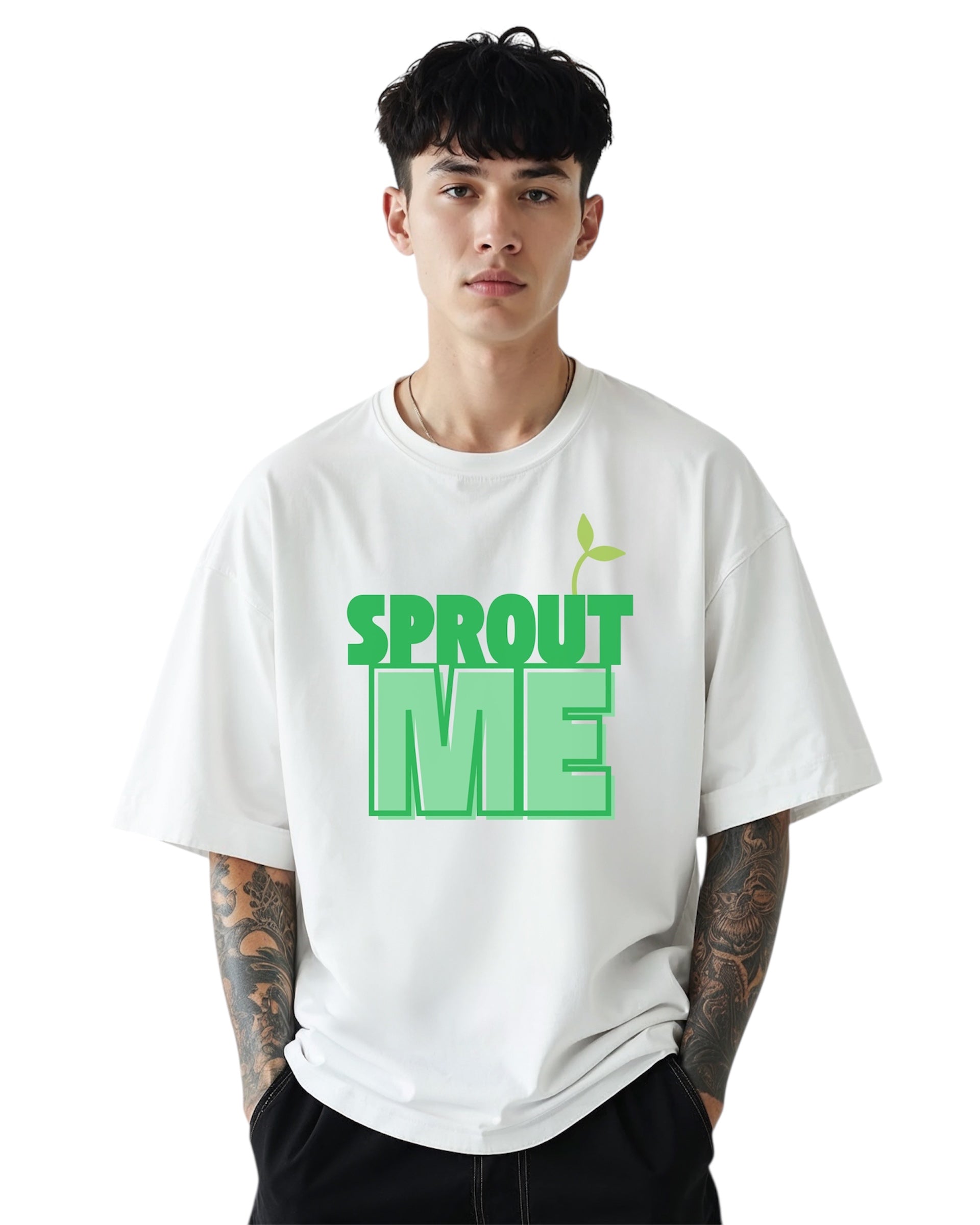 Model wearing a white oversized t-shirt with bold green text that says “Sprout Me” and a small sprout icon above the lettering, shown with hands in pockets against a white background.