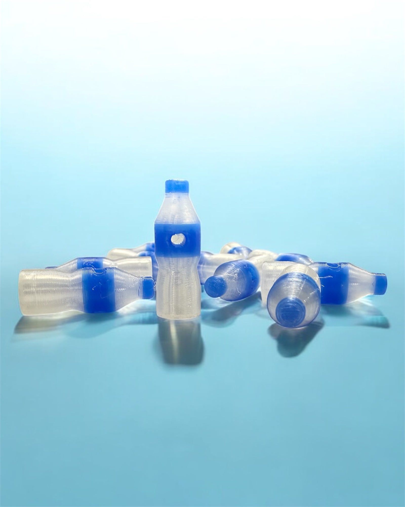 Blue and clear water bottle kandi beads on a light blue background