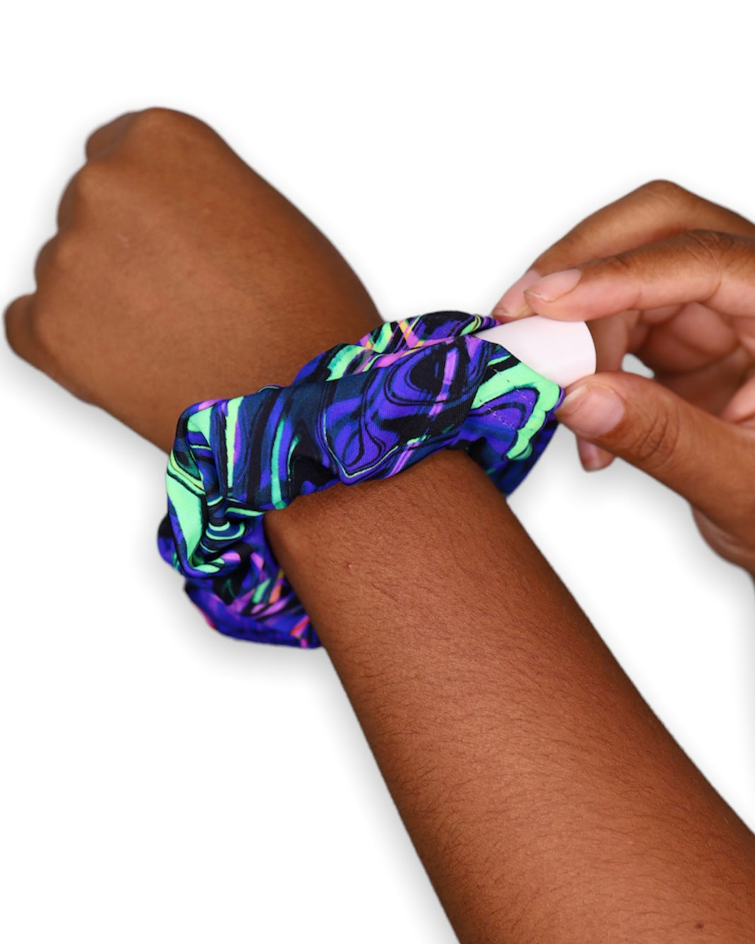 Acid Melt Stash Scrunchie with Velcro Hidden Pocket on a wrist showing off the hidden pocket - One Stop Rave.