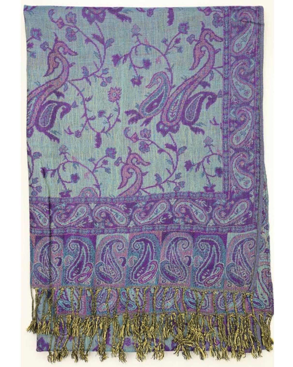 A reversible paisley pattern pashmina in purple and turquoise with fringes, draped around a neck.