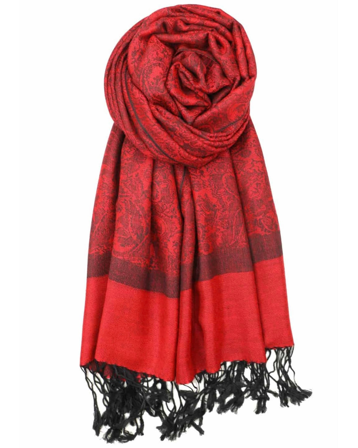 A red and black paisley patterned pashmina draped around a mannequin with fringes at the bottom.