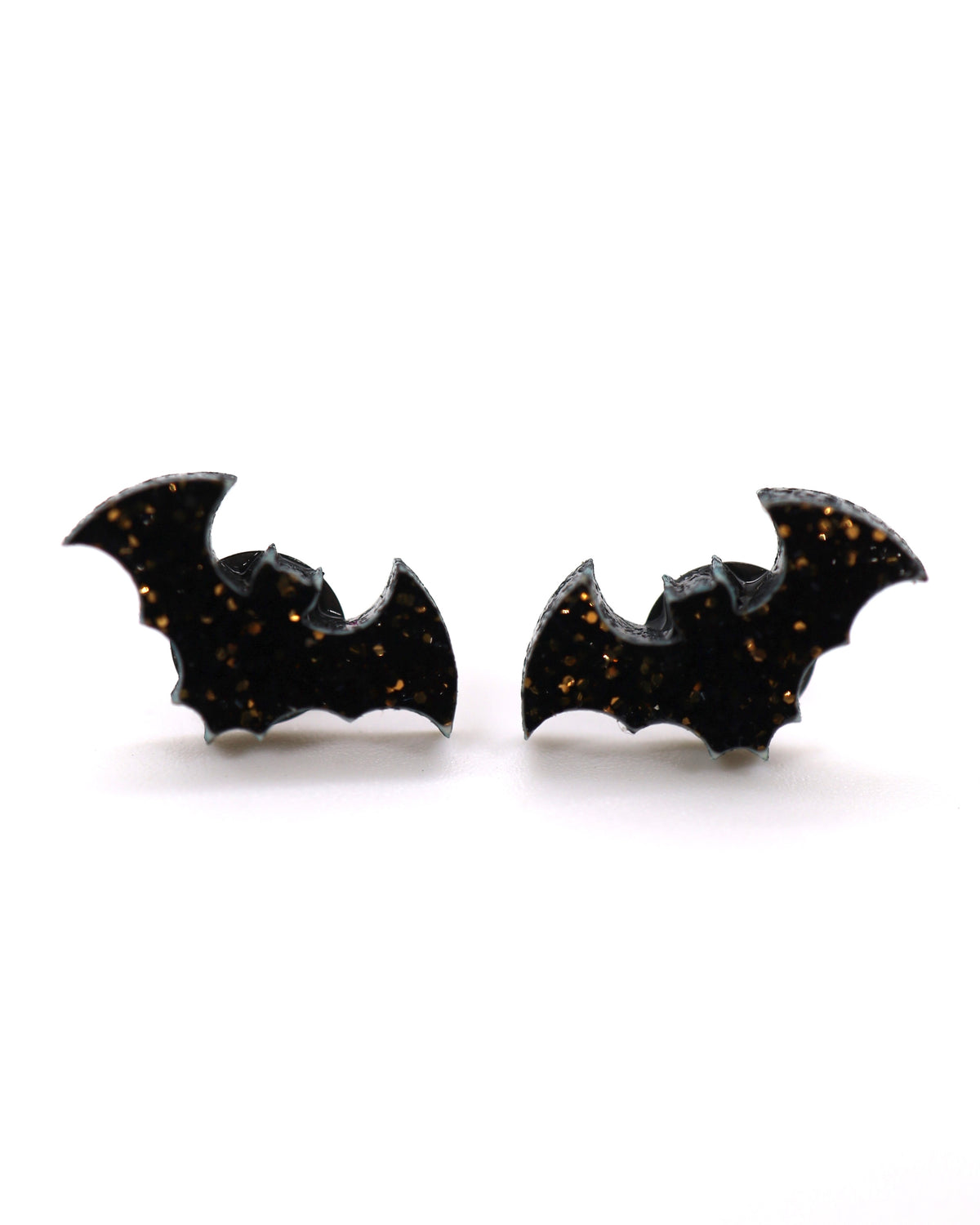 Black bat-shaped earrings on a white background