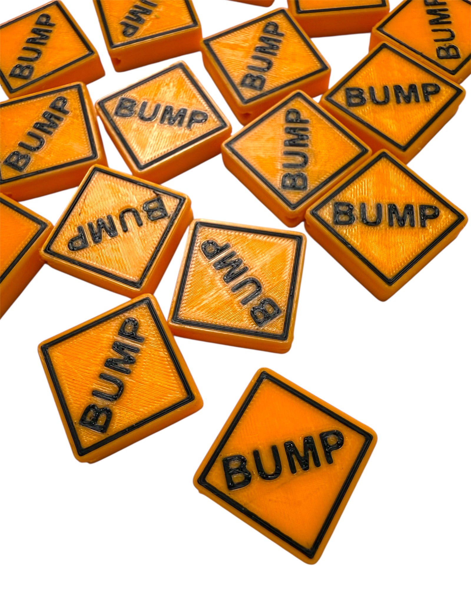 Orange square sign kandi beads with 'BUMP' text on a white background