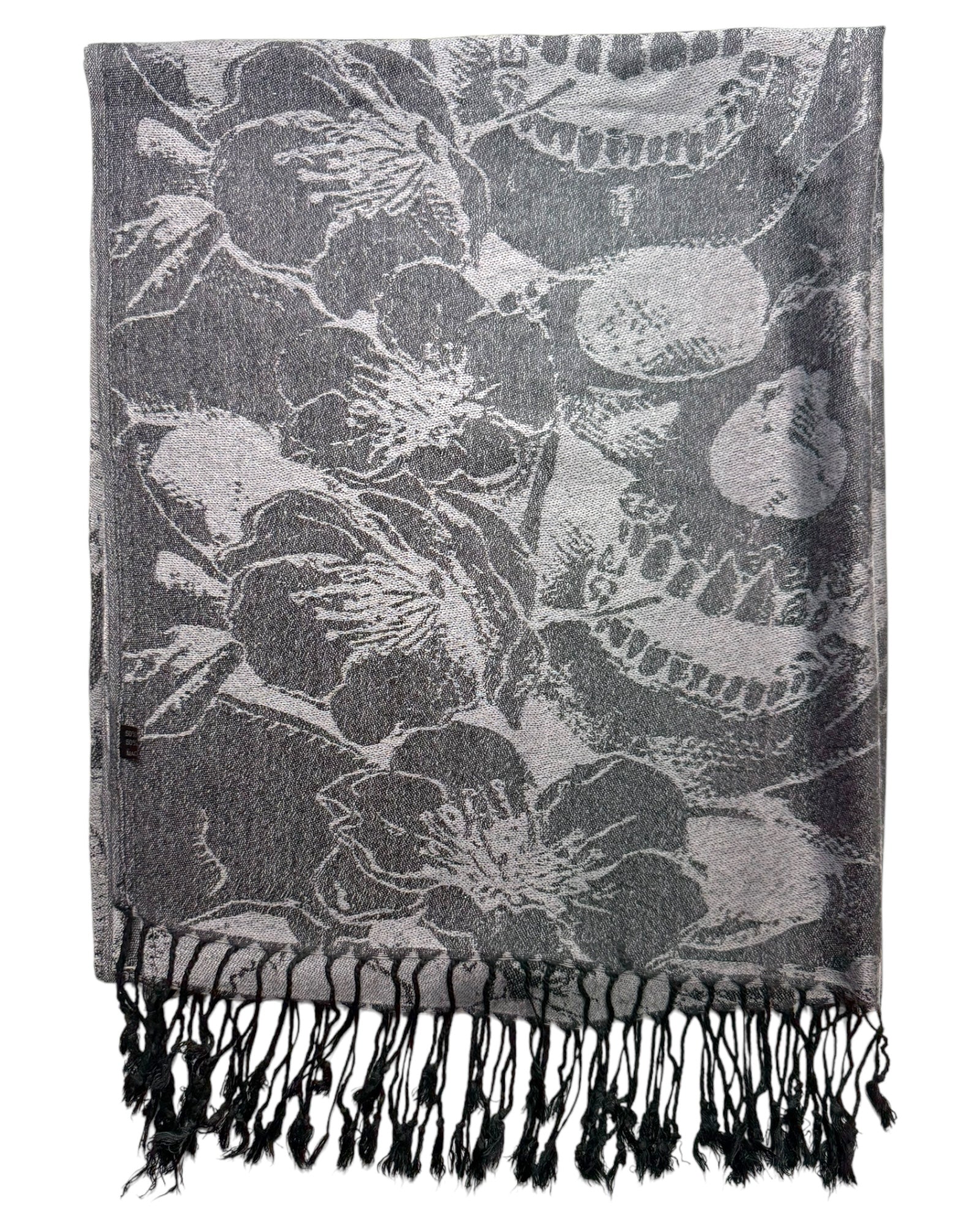 Floral patterned scarf with black tassels on a white background