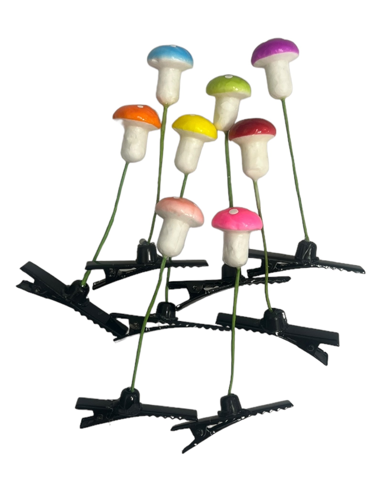 Eight mushroom sprout clips grouped together upright on white background.