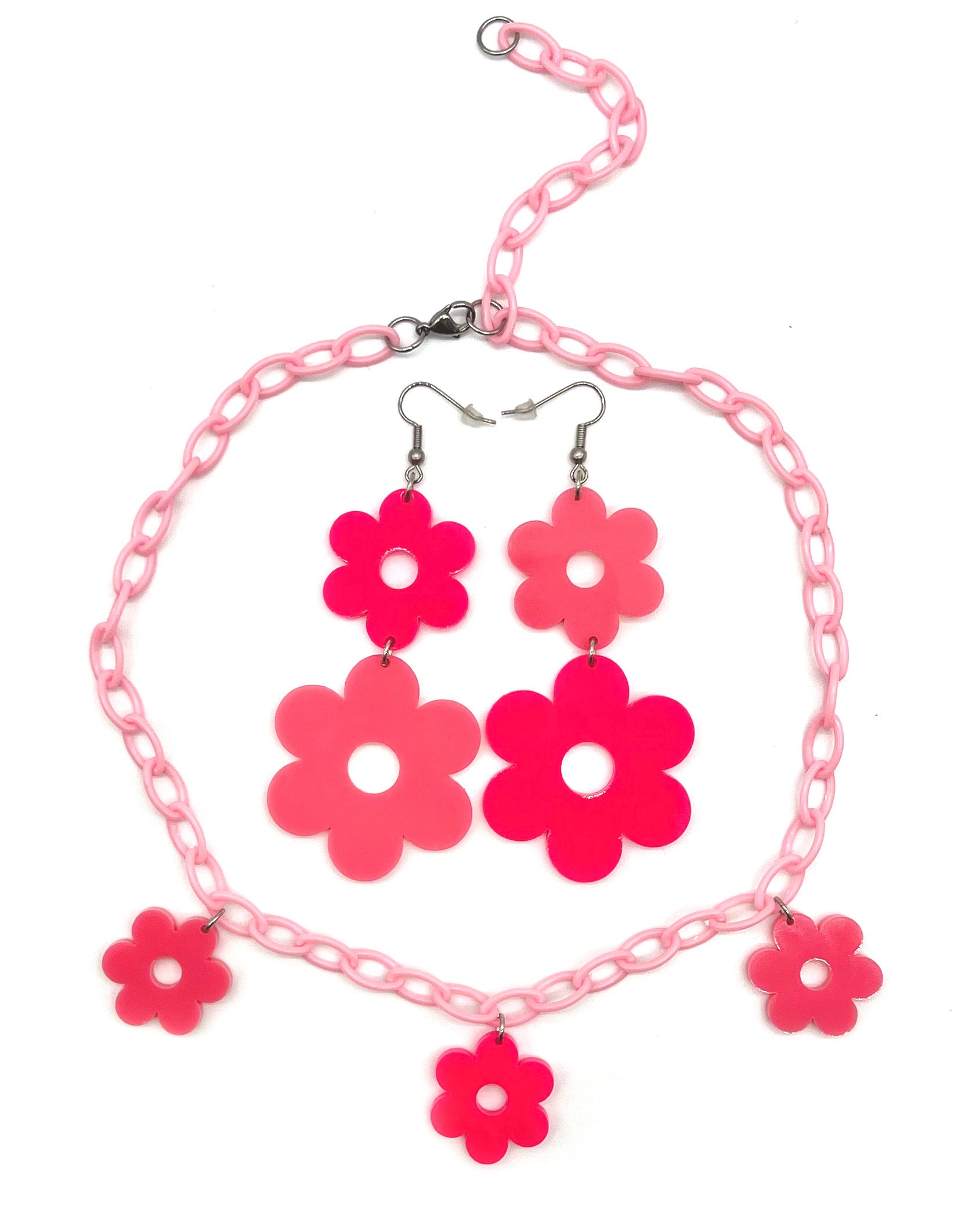 A pair of Flower Power Pink Earrings with the matching Flower Power Pink Necklace.