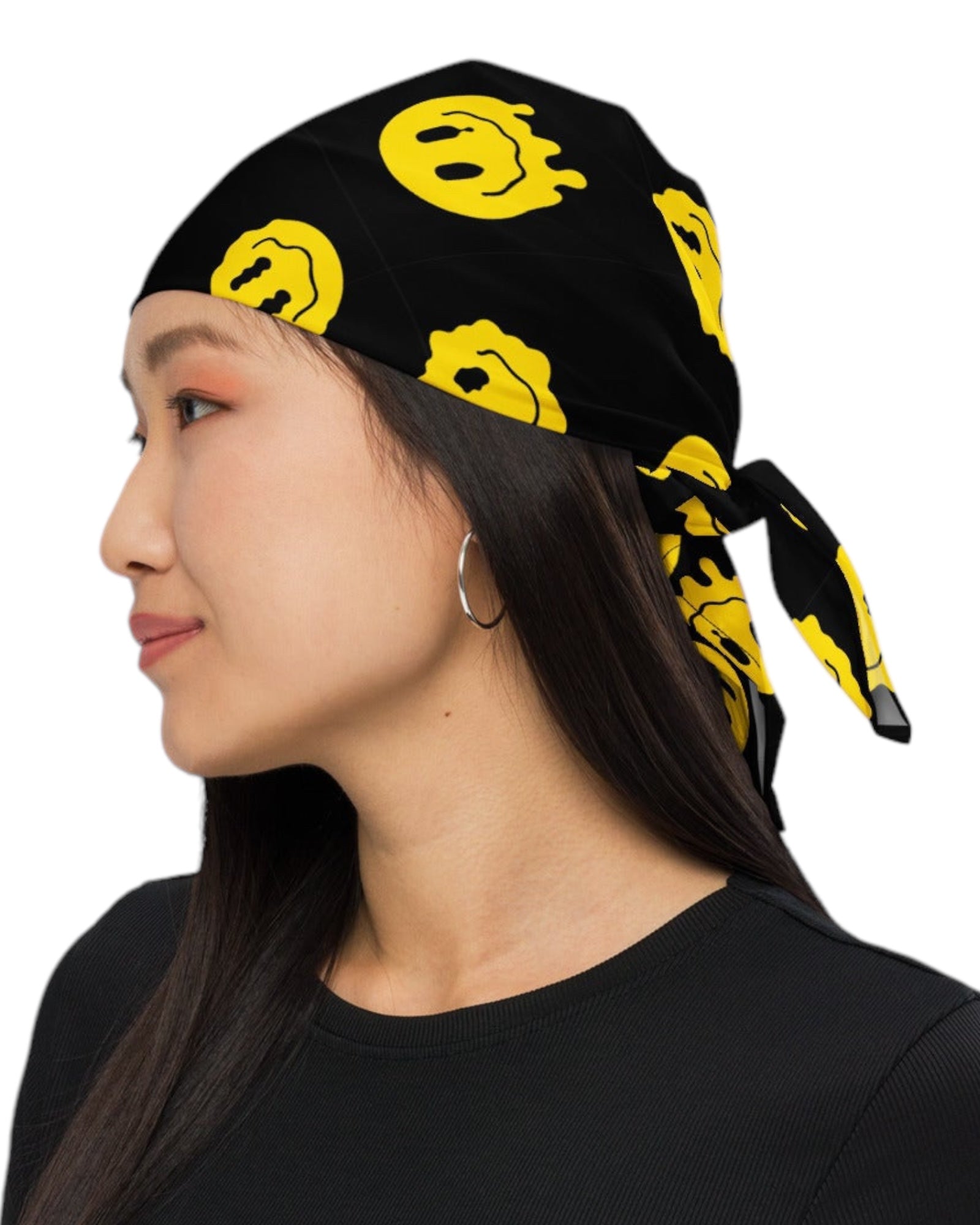 Woman wearing the Trippie Bandana on her head as a head scarf- Features a vibrant yellow smiley face pattern on a black background, adding a bold touch to her rave outfit.