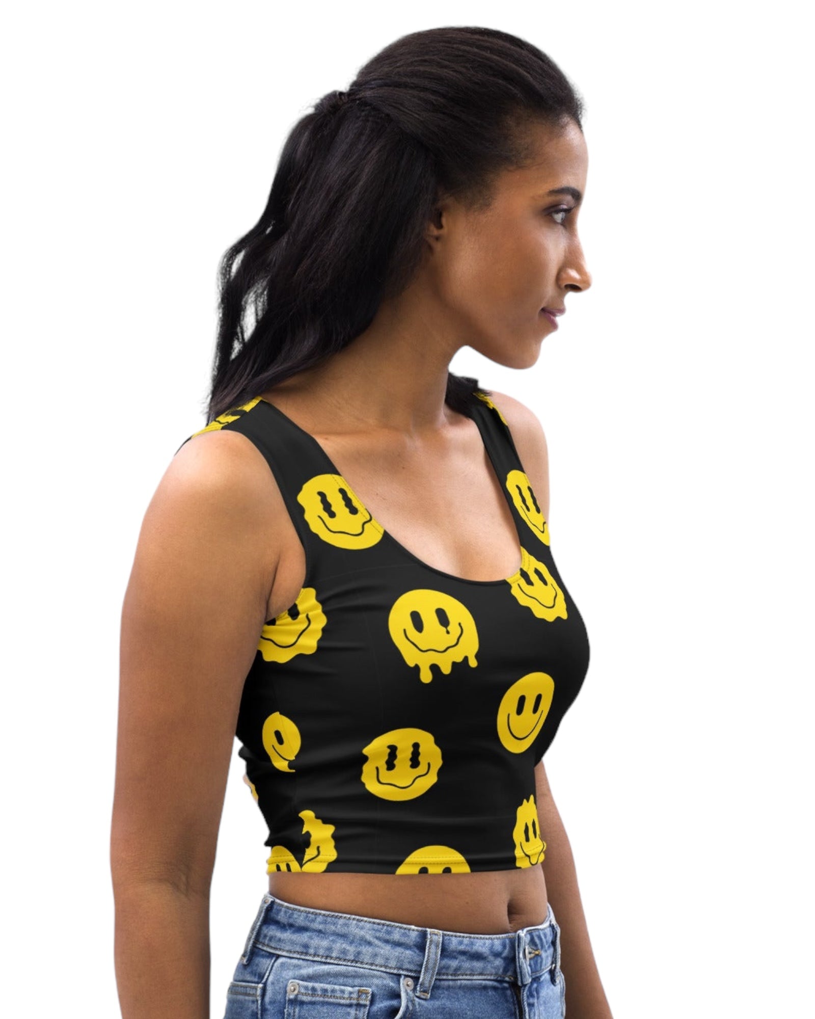 Side view of Trippie Crop Top model - Featuring yellow smiley faces on a black crop top, ideal for festival fashion and rave outfits.