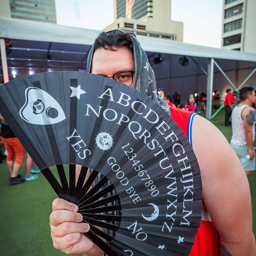 Wake the Dead Ouija board hand fan held at Down Town Las Vegas Events Center.