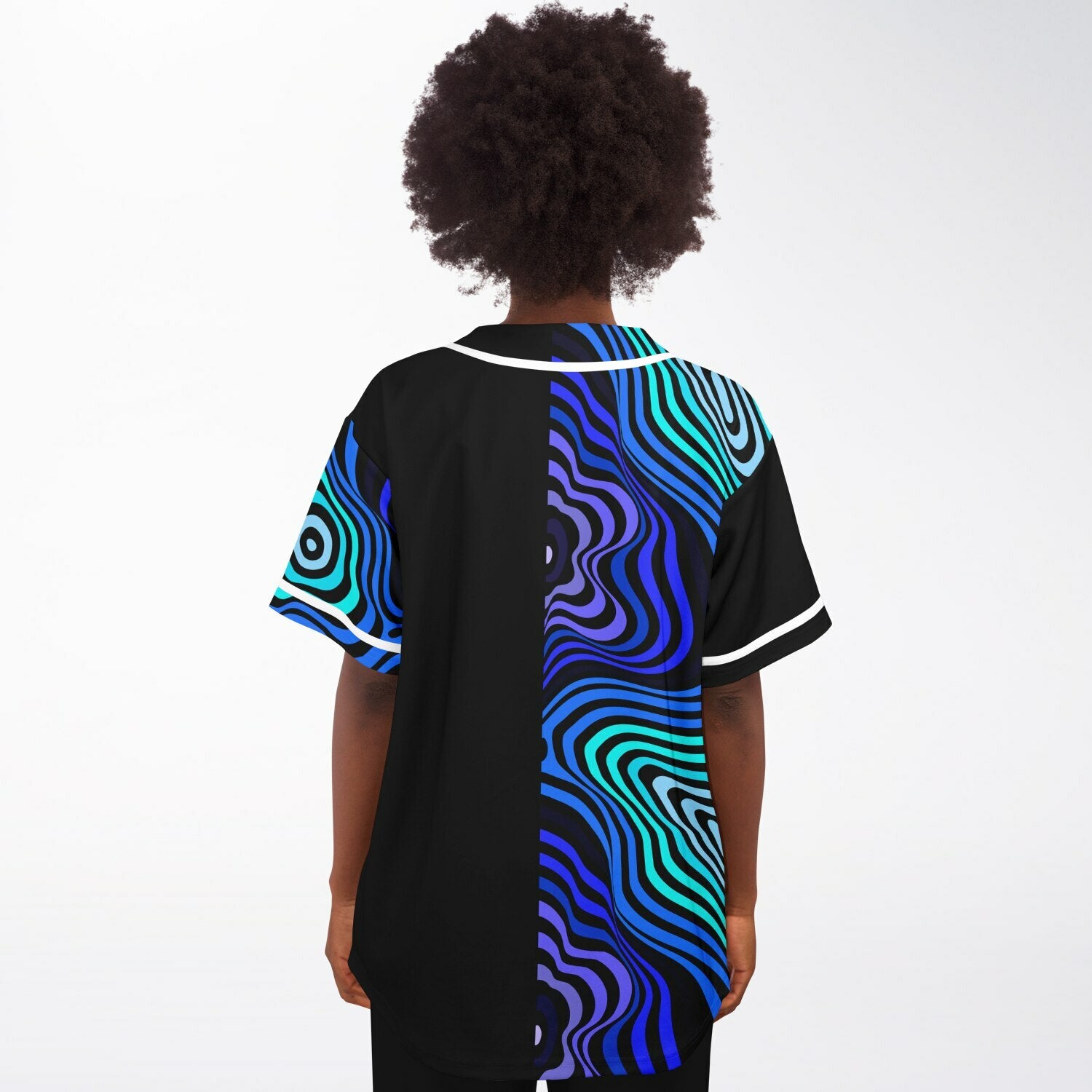 Woman wearing blue psychedelic festival jersey from back