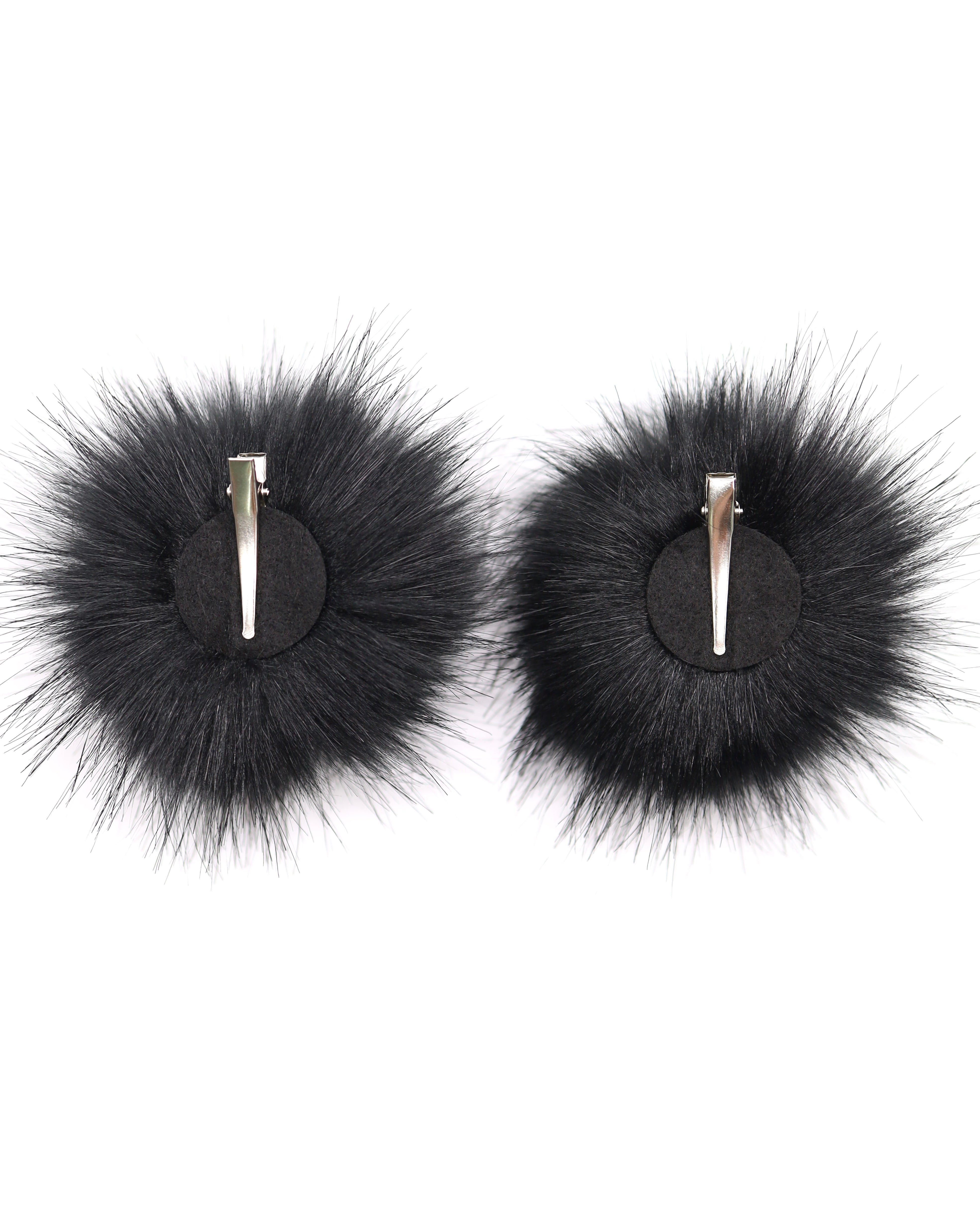 The bottom of black space bunz, Felt Pad glues on to the bottom of fuax fur pom poms with silver aligator clip.