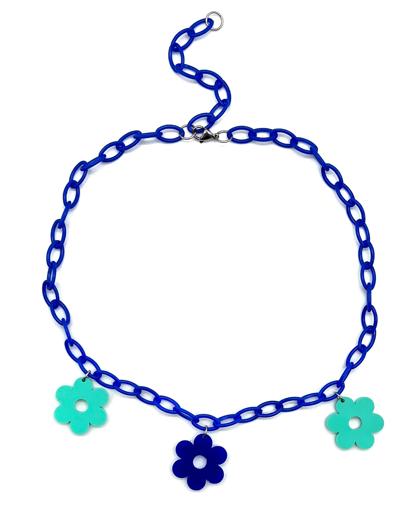 The Flower Power Blue Choker featuring a navy plastic chain with three alternating blue and teal daisy charms.