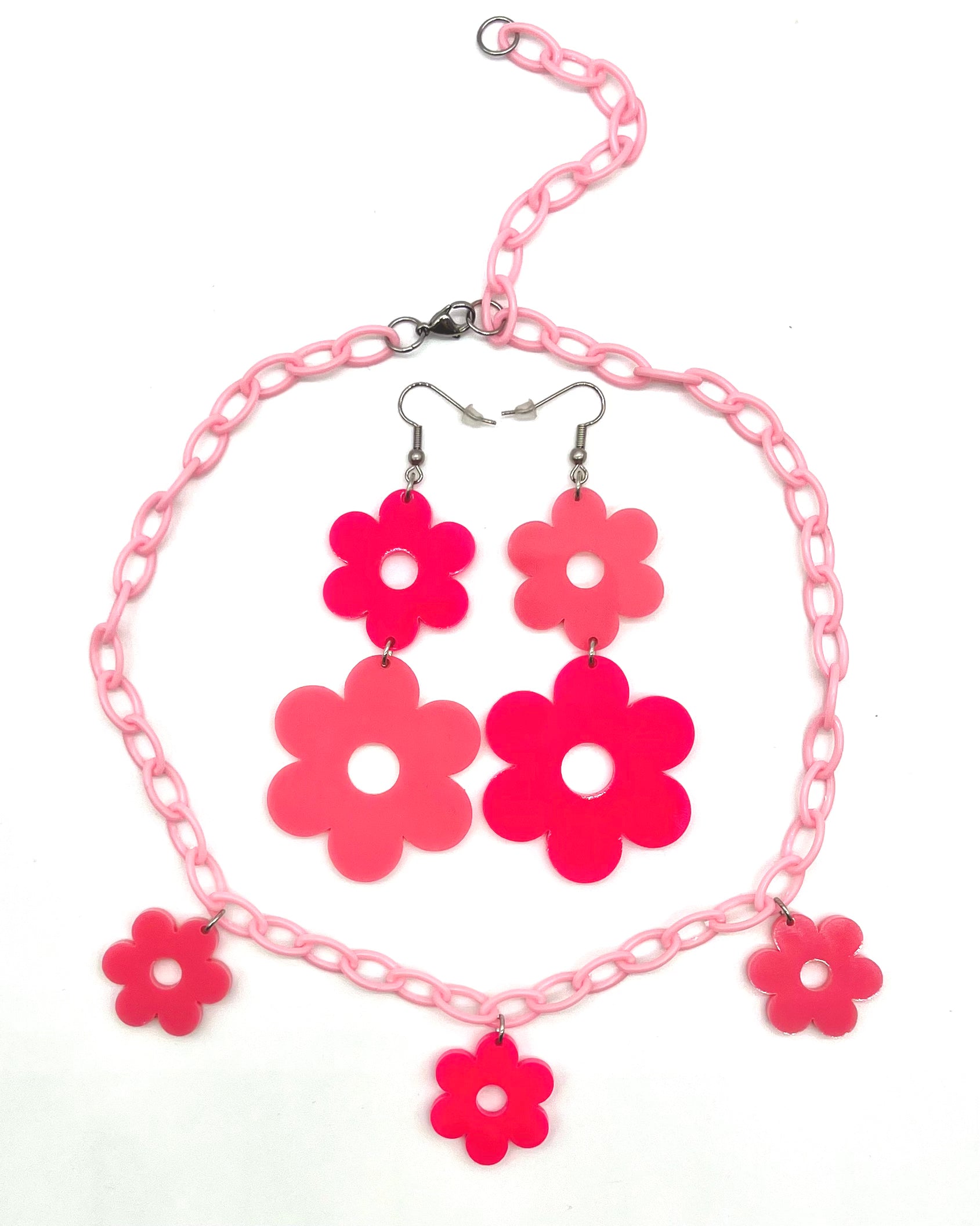 A pair of Flower Power Pink Earrings with the matching Flower Power Pink Necklace.